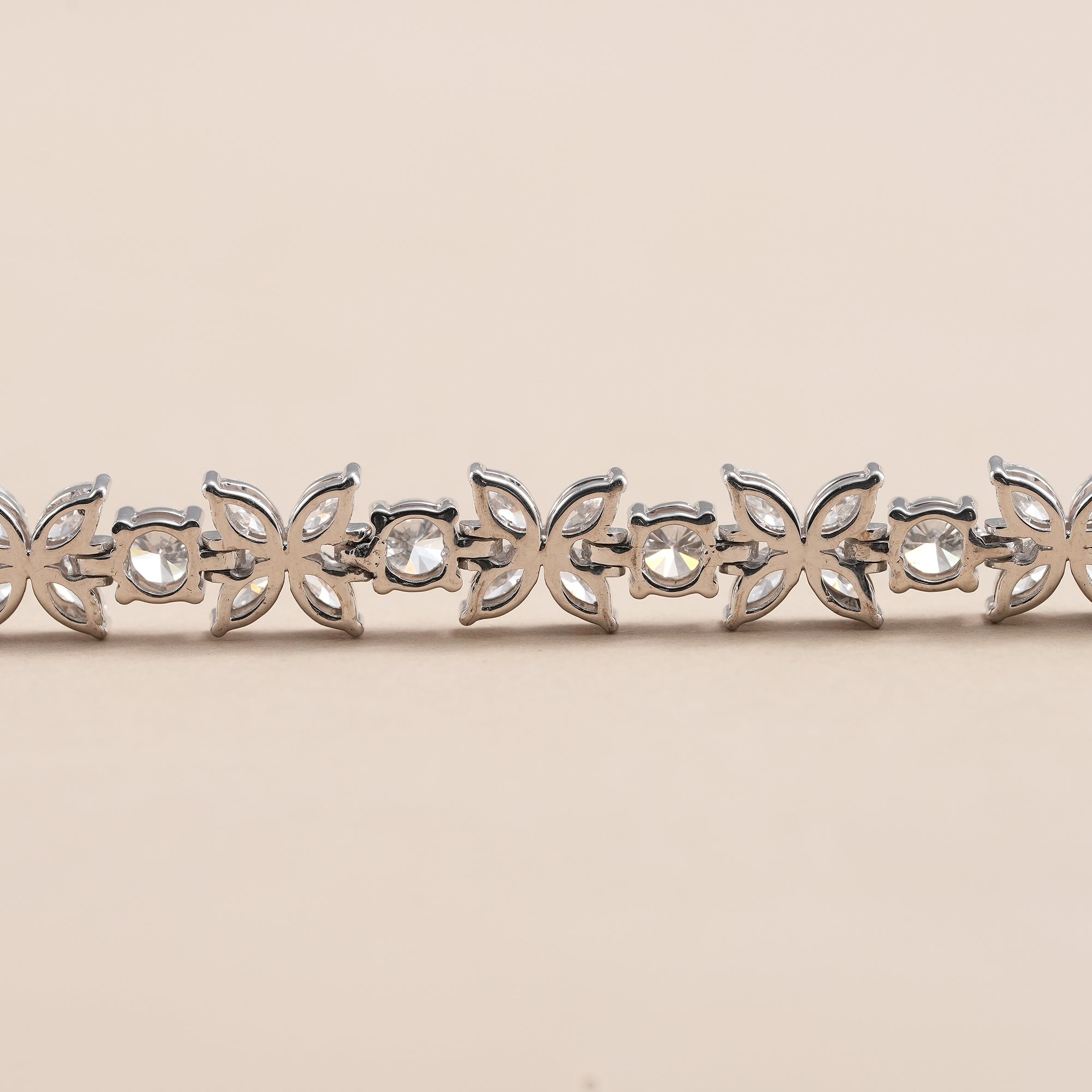 Marquise diamond floral motif tennis bracelet for women.