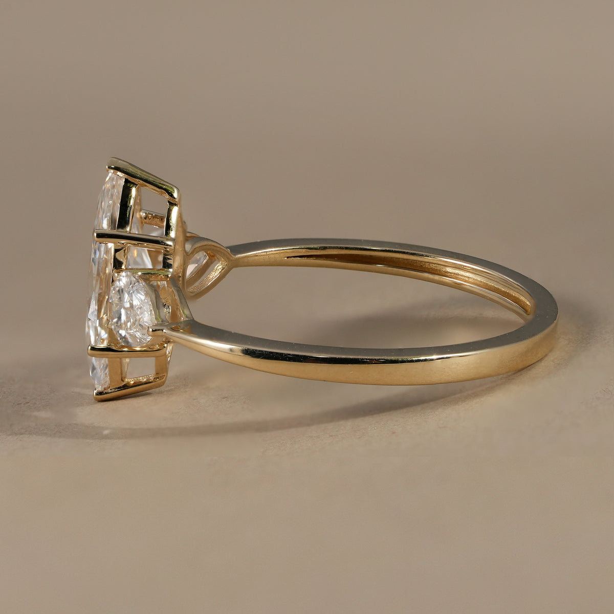 Three stone marquise diamond engagement ring handcrafted with lab grown diamonds.