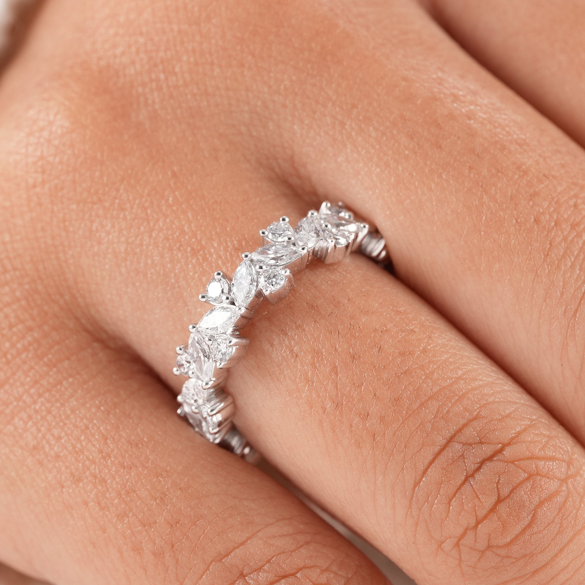 Floral inspired diamond eternity band with sparkling lab diamonds.