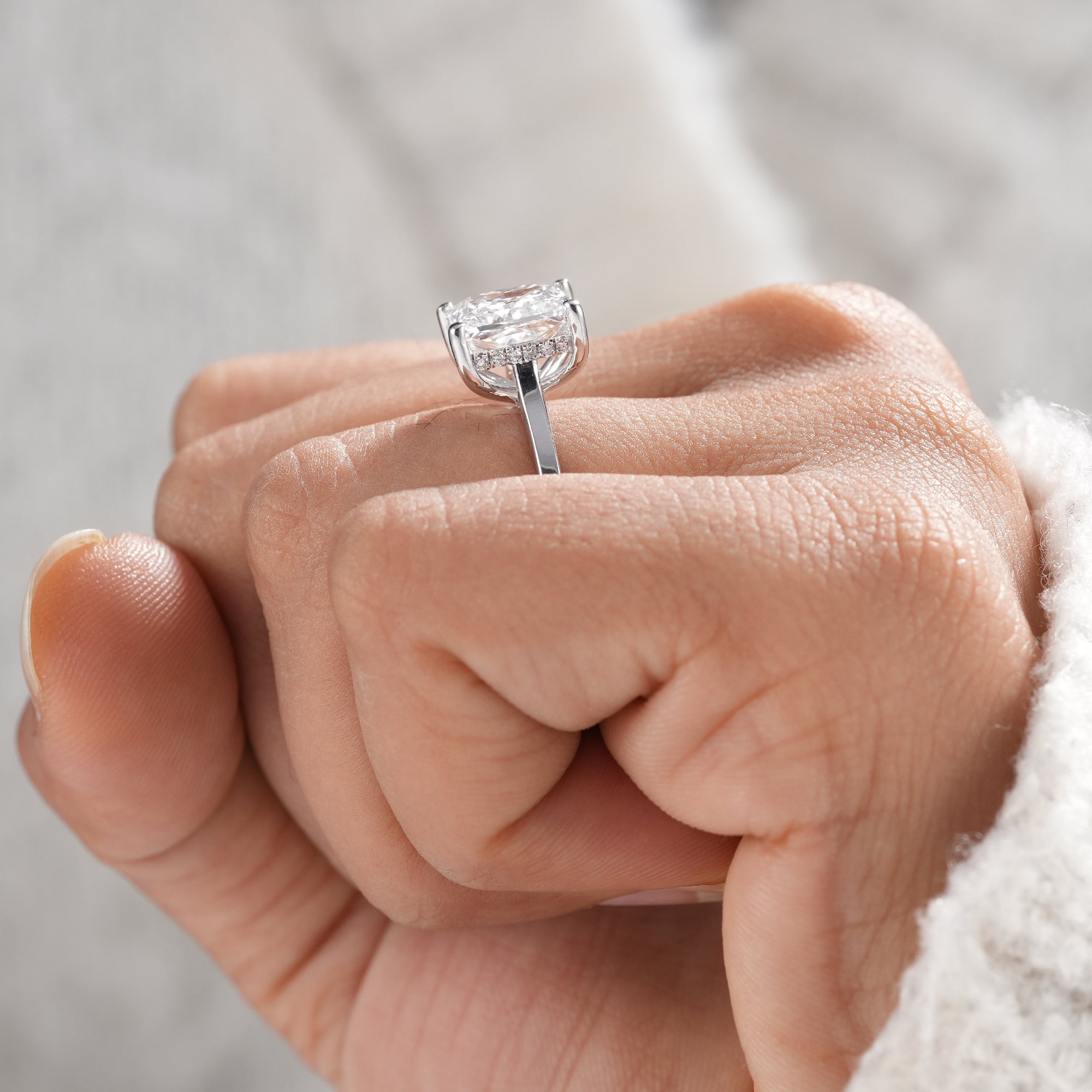 Fine jewelry princess cut solitaire ring with IGI certified diamond.