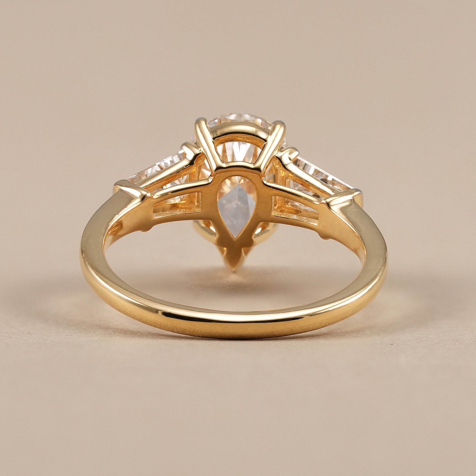 Luxury pear lab grown diamond ring with tapered baguette setting