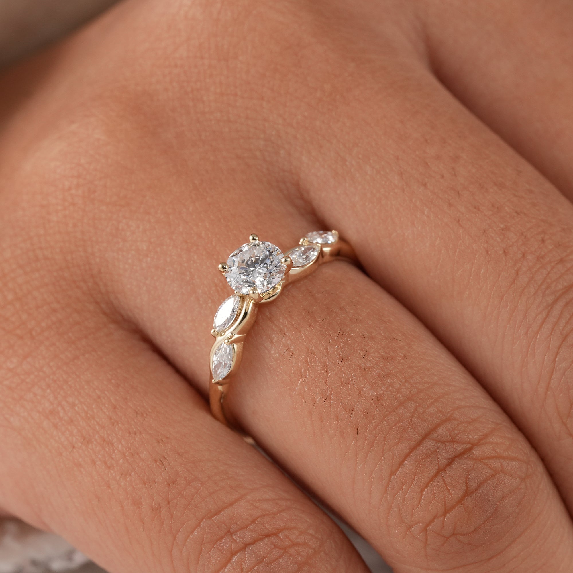 Sustainable lab diamond proposal ring with flowing shank.