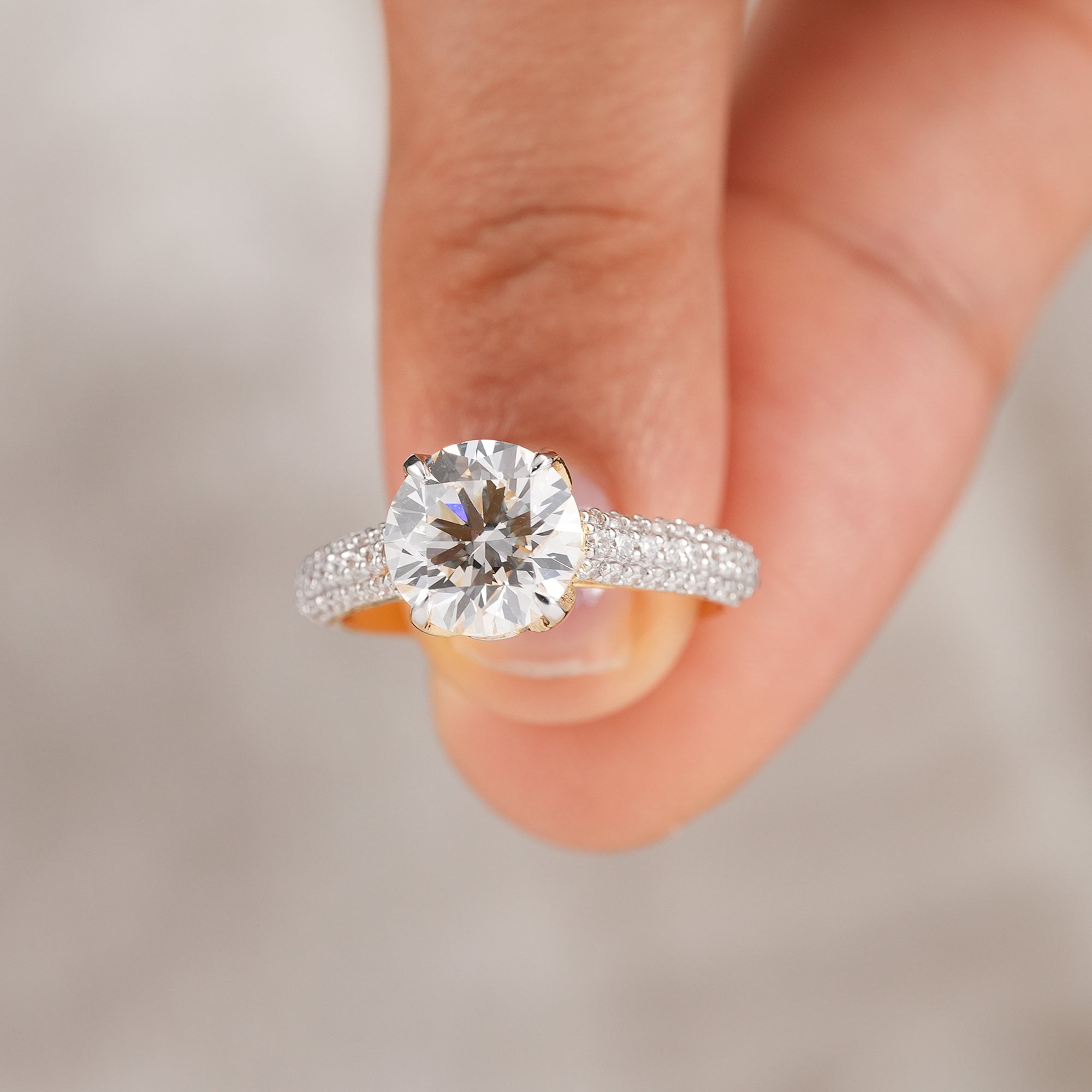 Round solitaire lab diamond ring featuring a classic four prong setting