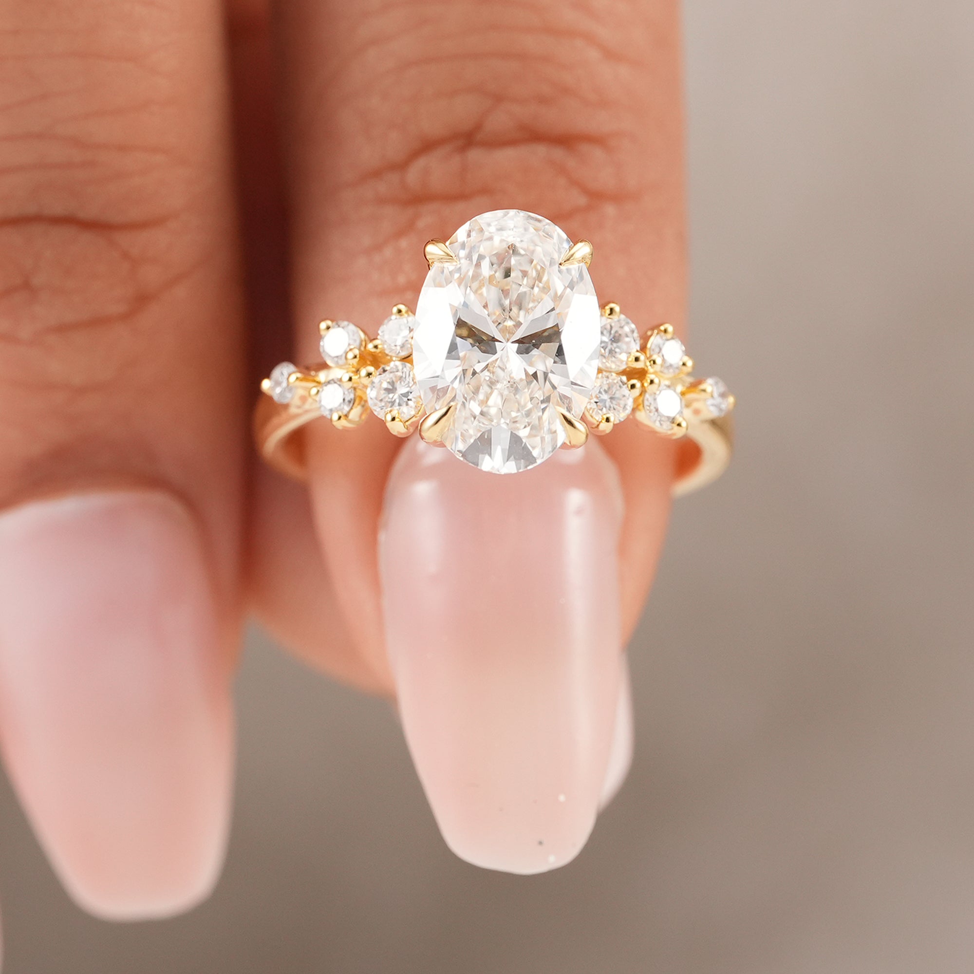 Floral oval diamond ring featuring lab grown center stone in yellow gold
