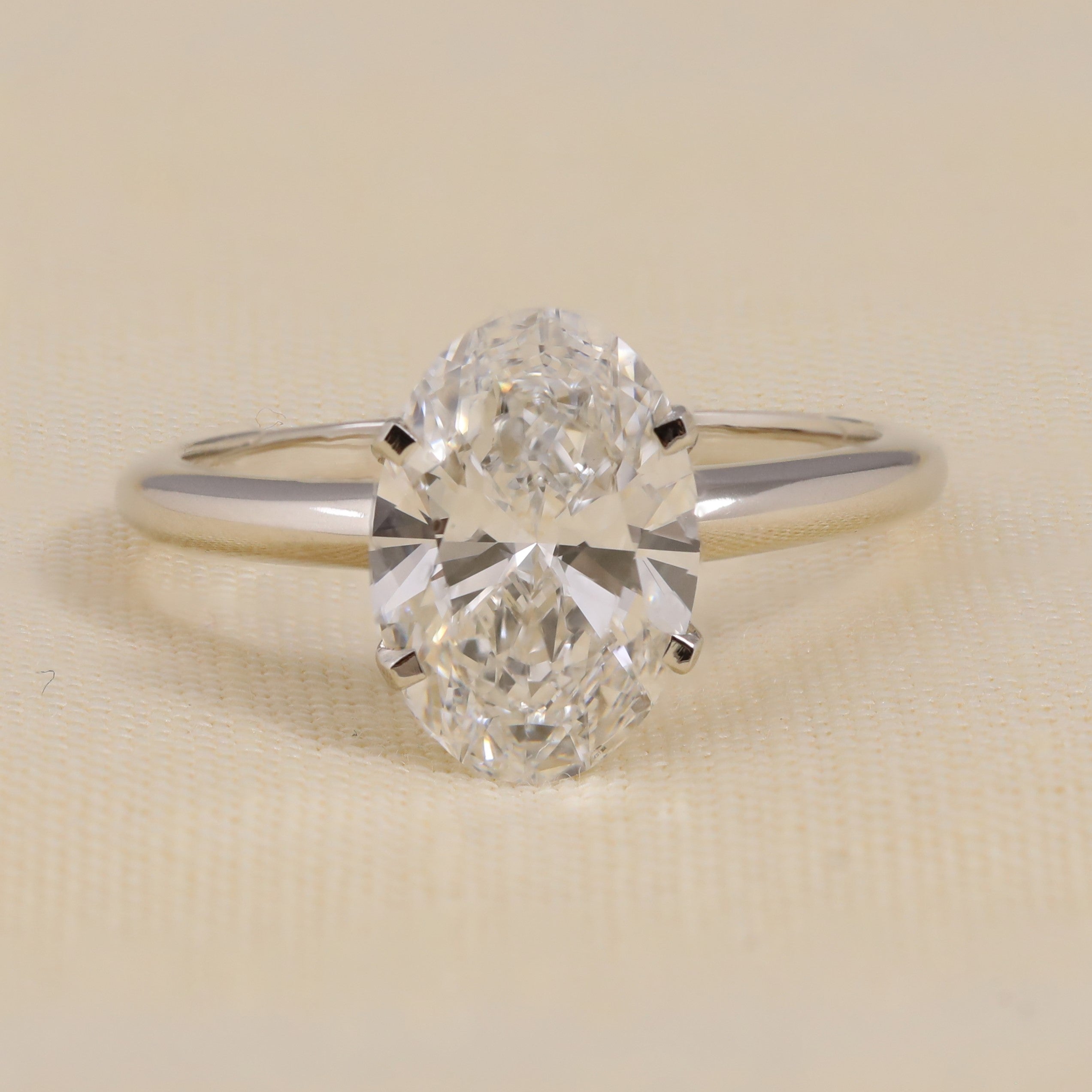 Oval lab grown diamond engagement ring in classic solitaire setting