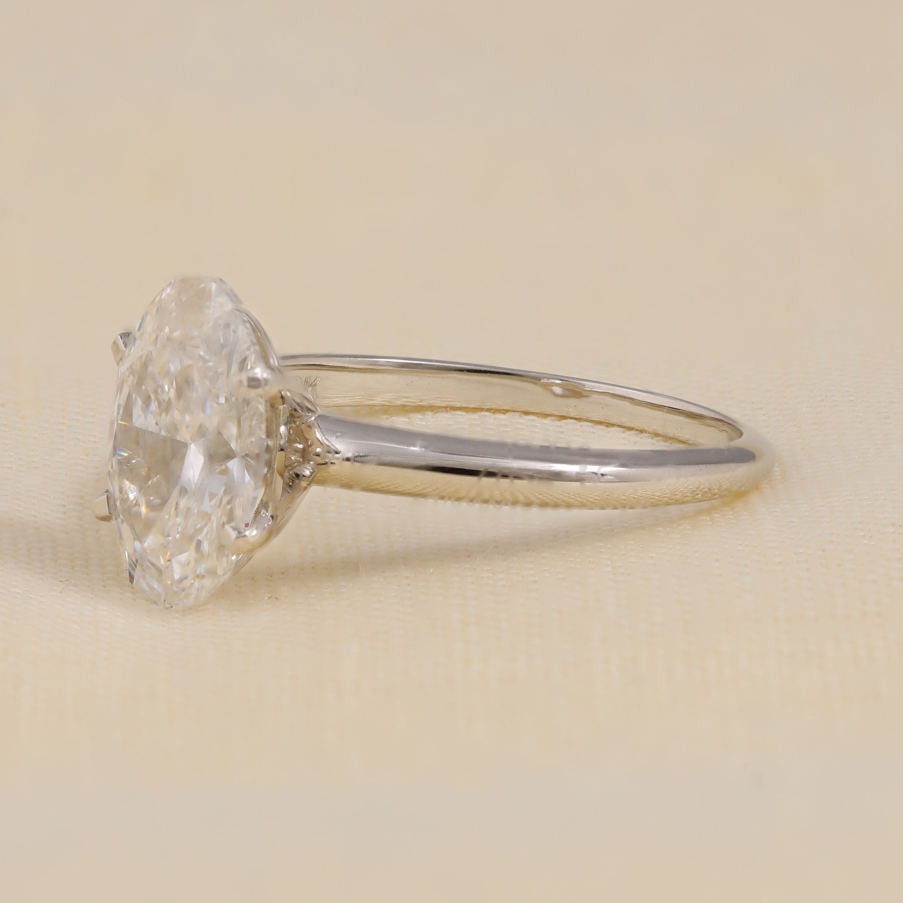 Simple oval lab grown diamond engagement ring with minimalist band