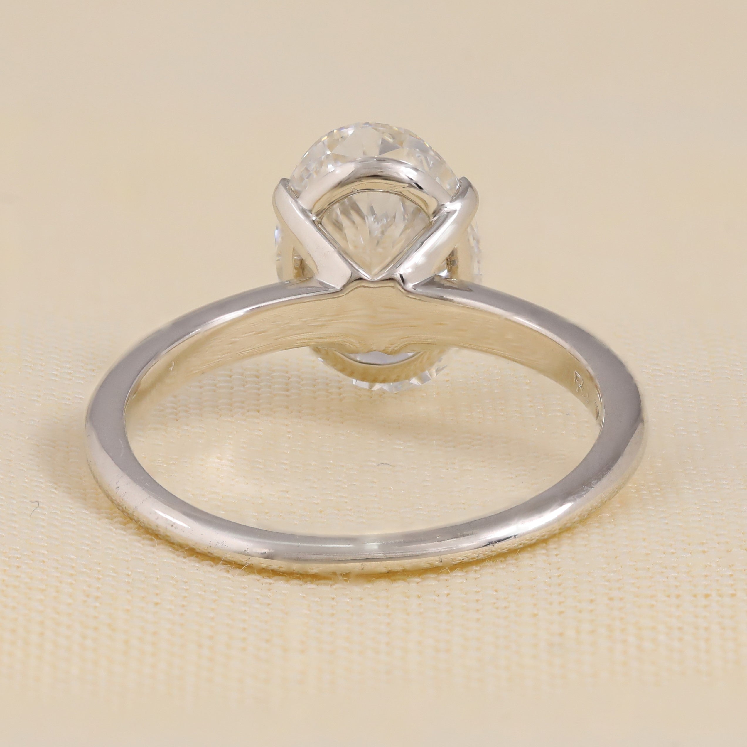Classic oval lab grown diamond engagement ring with sleek band