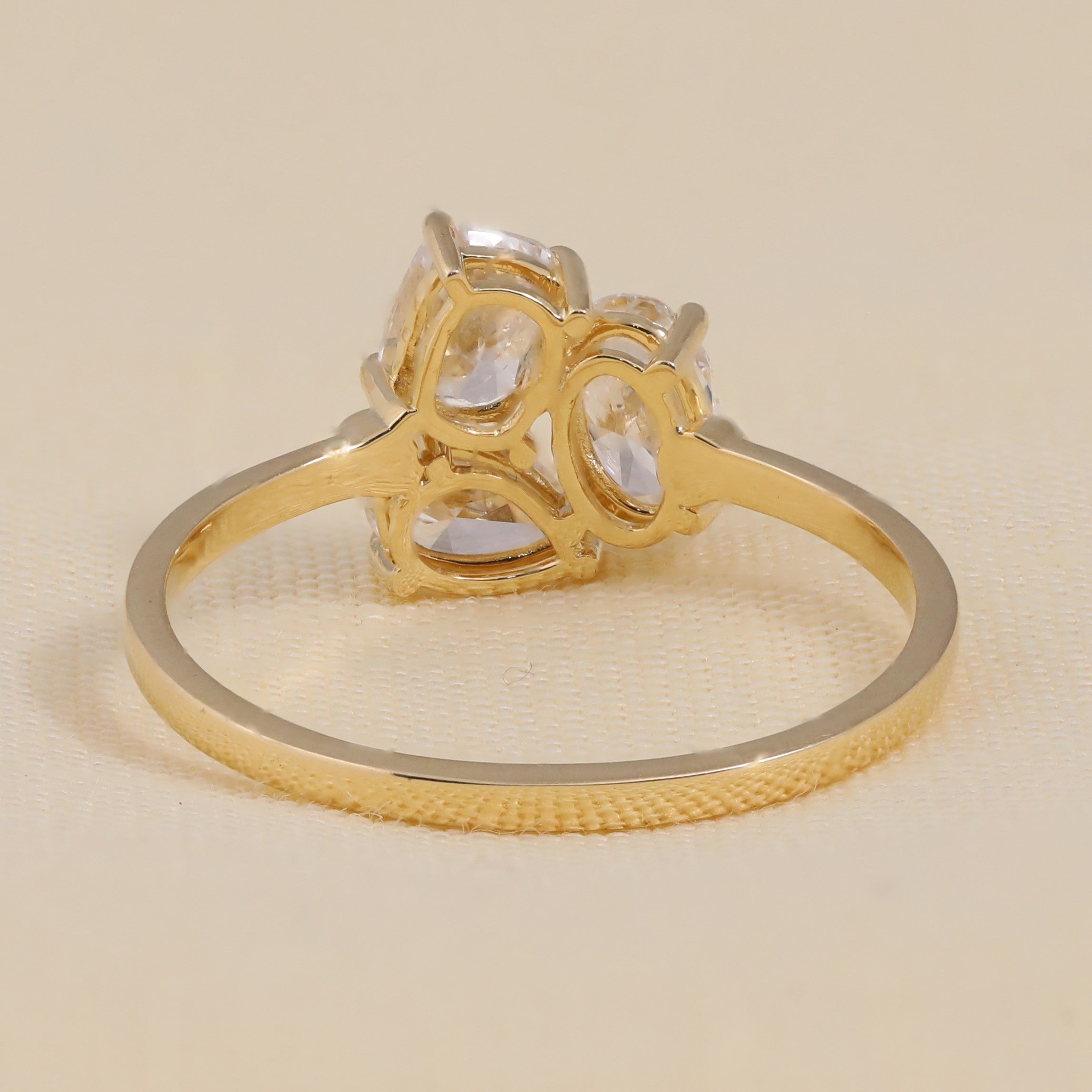 Contemporary design mixing oval lab grown diamond elements with cluster stones