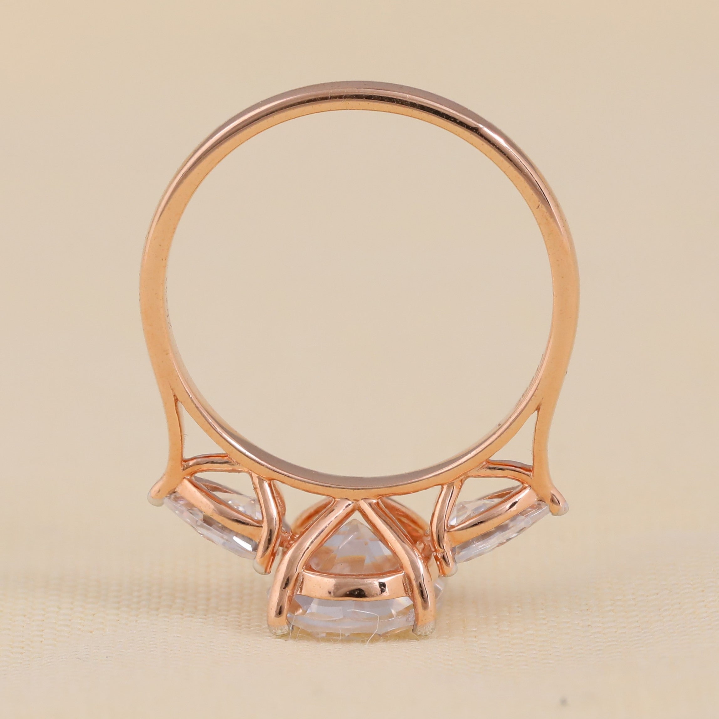 Elegant three stone engagement ring oval center and pear diamonds