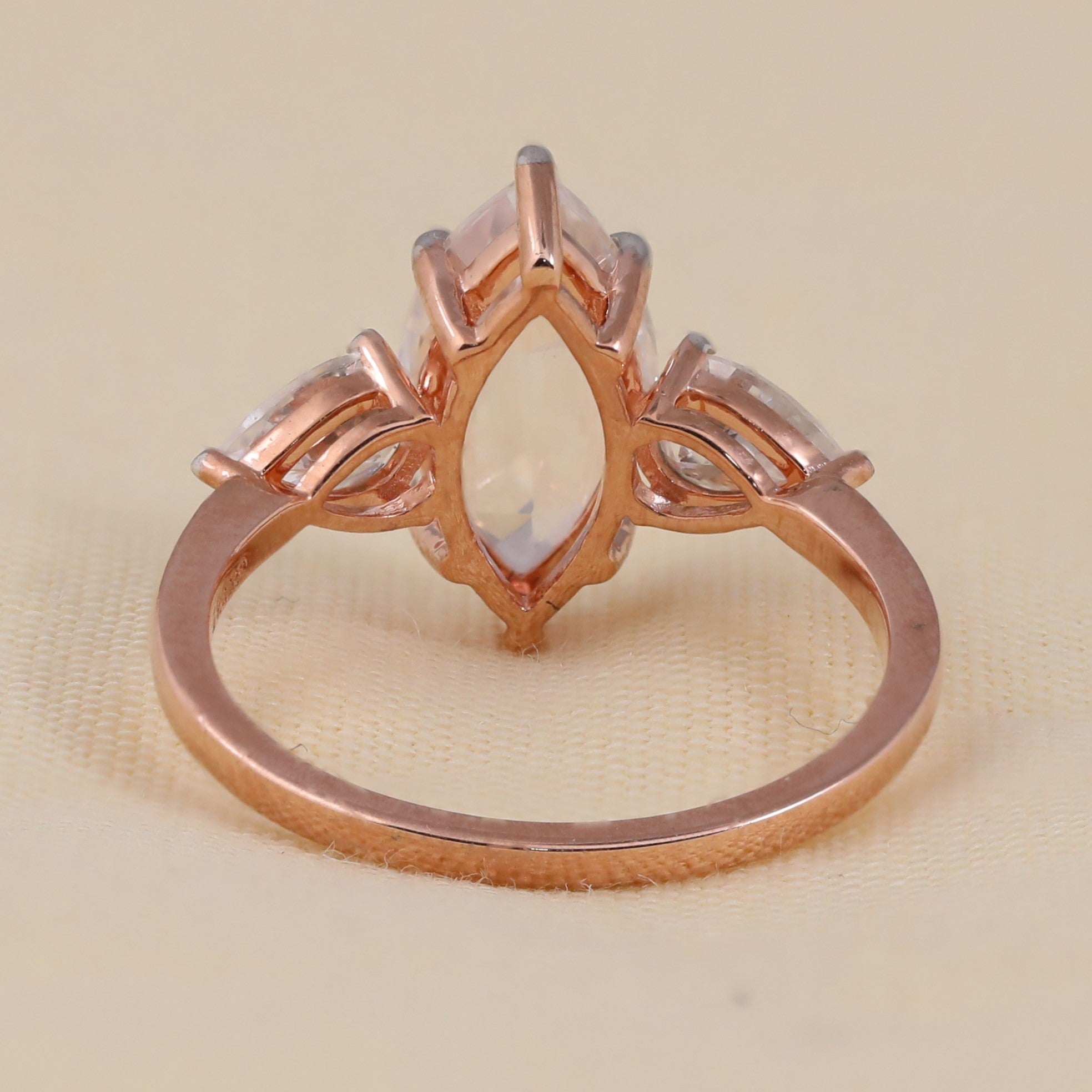 Elegant marquise cut bridal ring with pear side stones for engagement