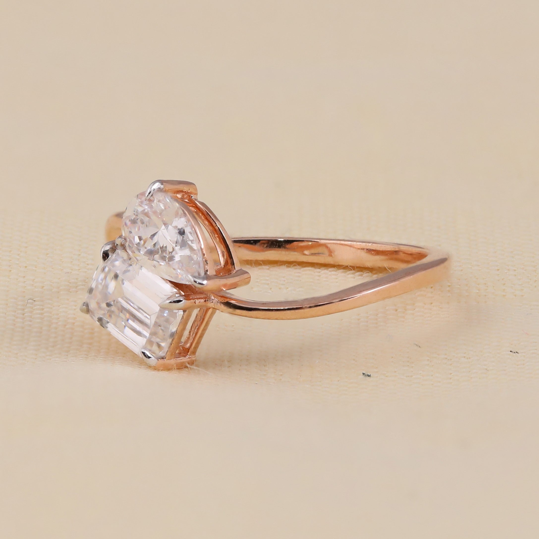 Two-stone pear and emerald diamond engagement ring design