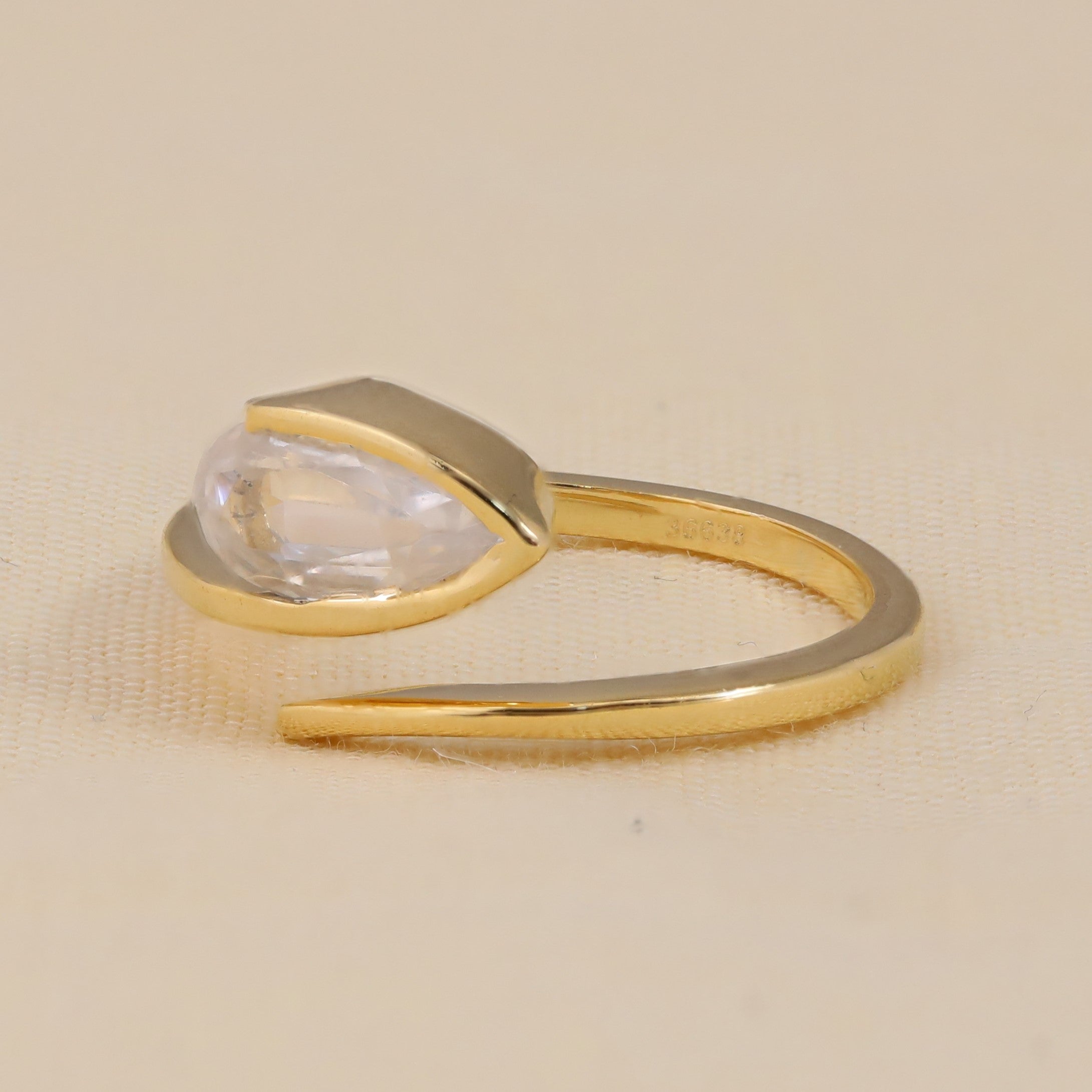 Bezel Set Marquise shaped lab grown diamond ring in bypass design for proposal