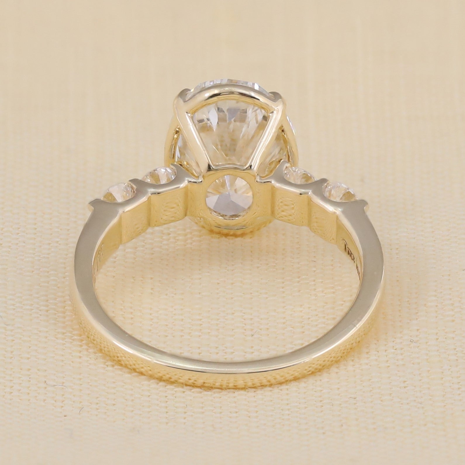Lab grown oval engagement ring with round accent stones