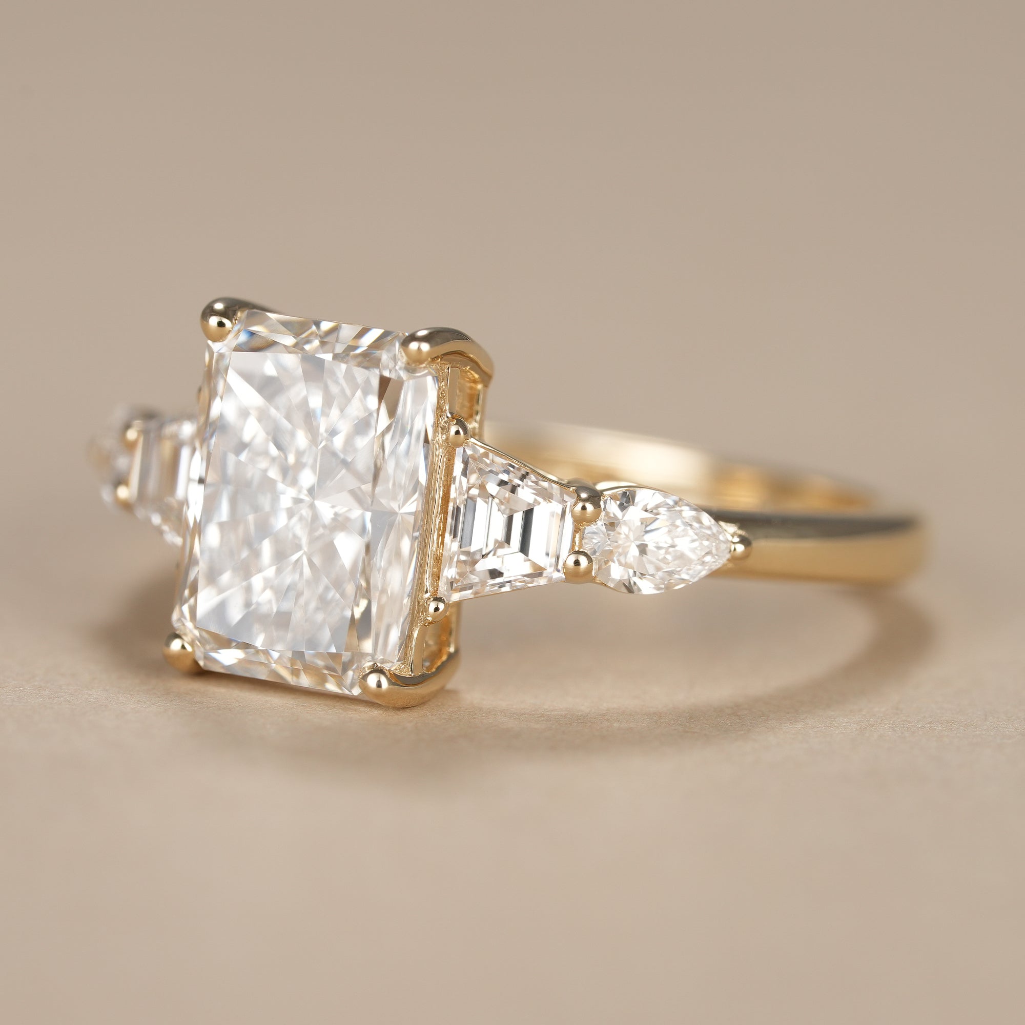 Multi Stone Radiant Lab Diamond Engagement Ring With Tapered Baguette Side Stones