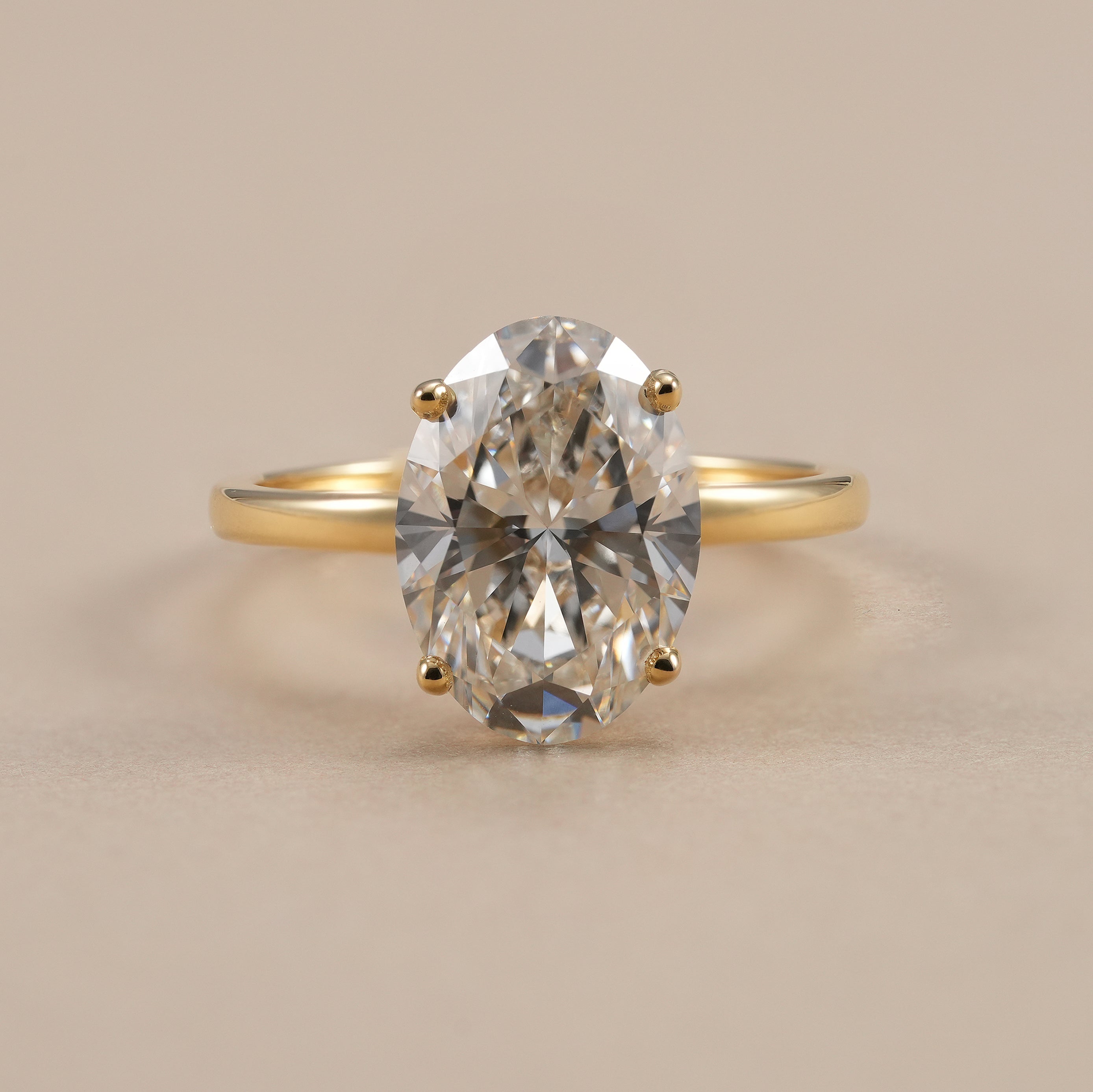 3.5 CT oval lab diamond solitaire engagement ring in yellow gold.