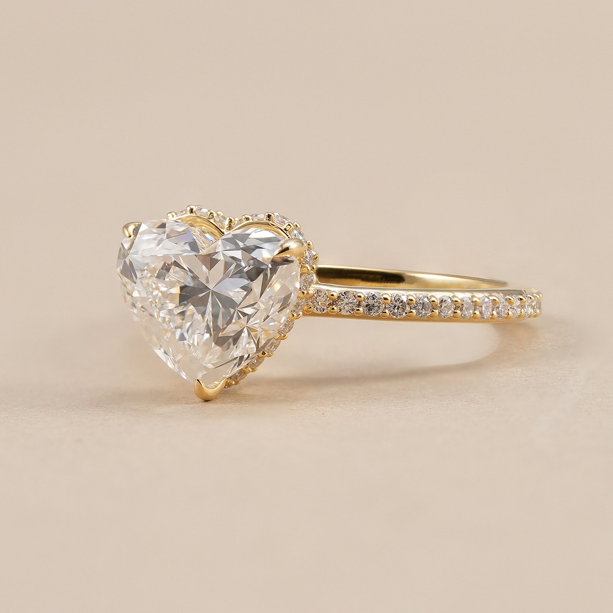 Hidden halo heart diamond engagement ring with sparkling pavé band