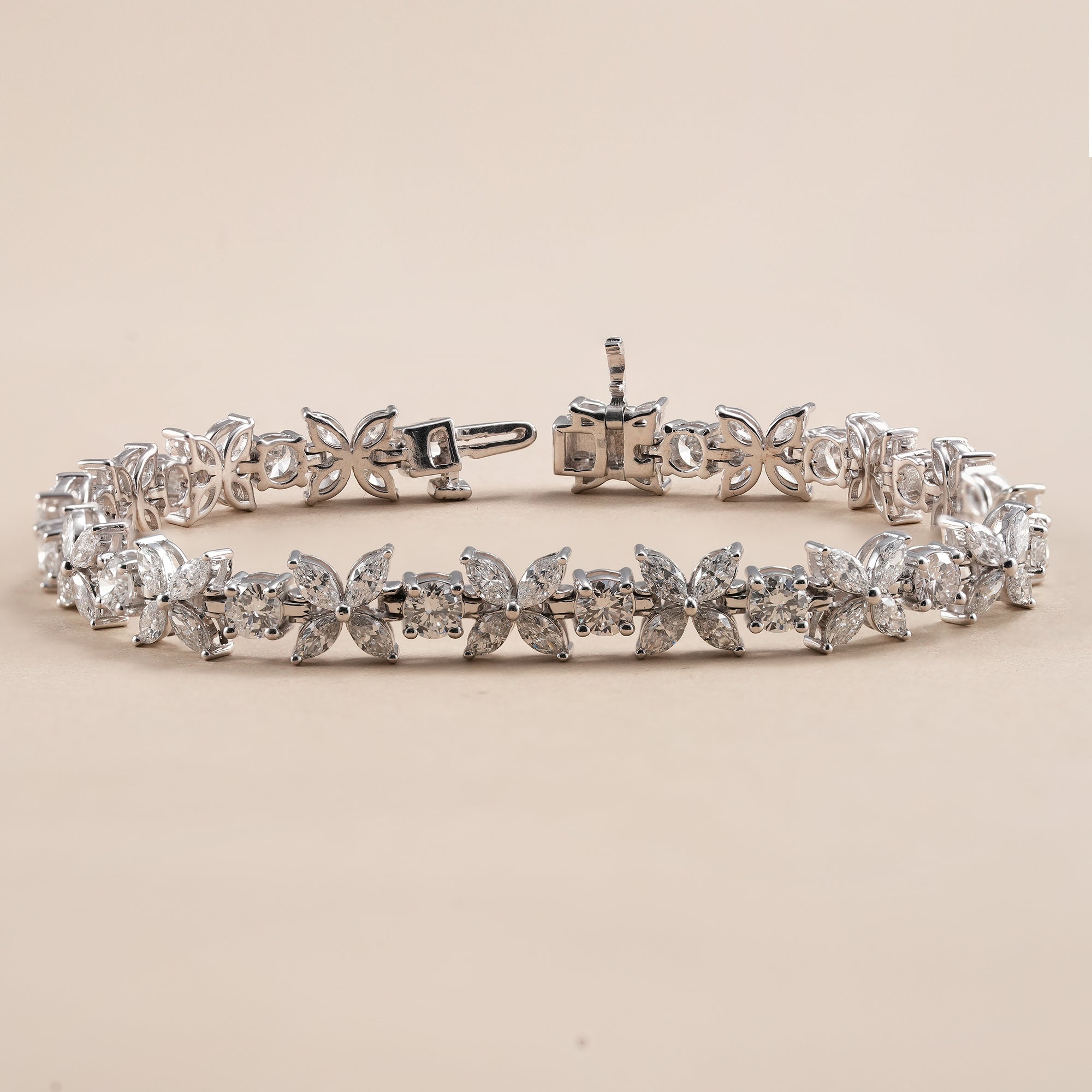 Fine jewelry butterfly diamond bracelet with marquise diamond clusters.