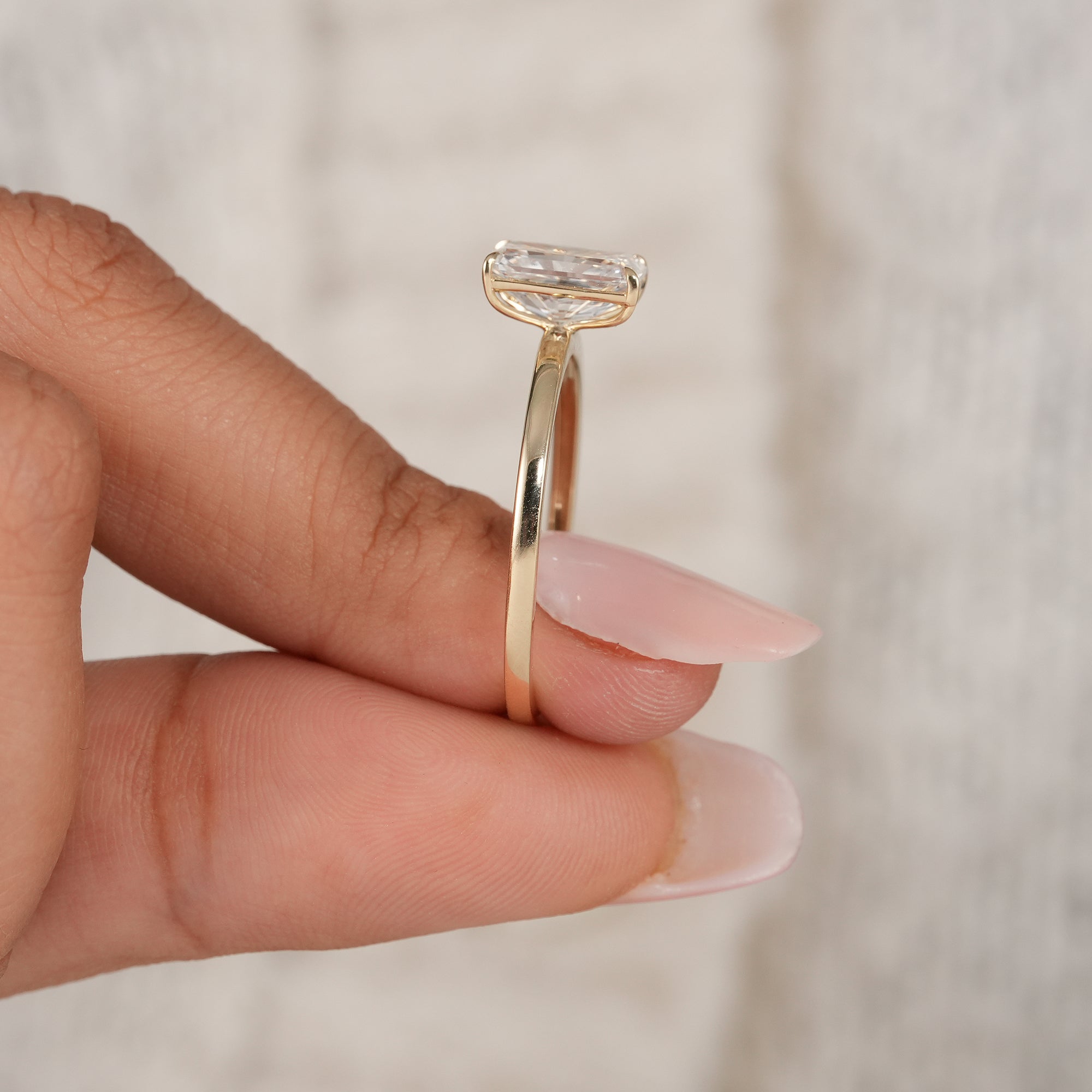 Fine jewelry radiant diamond engagement ring close-up.