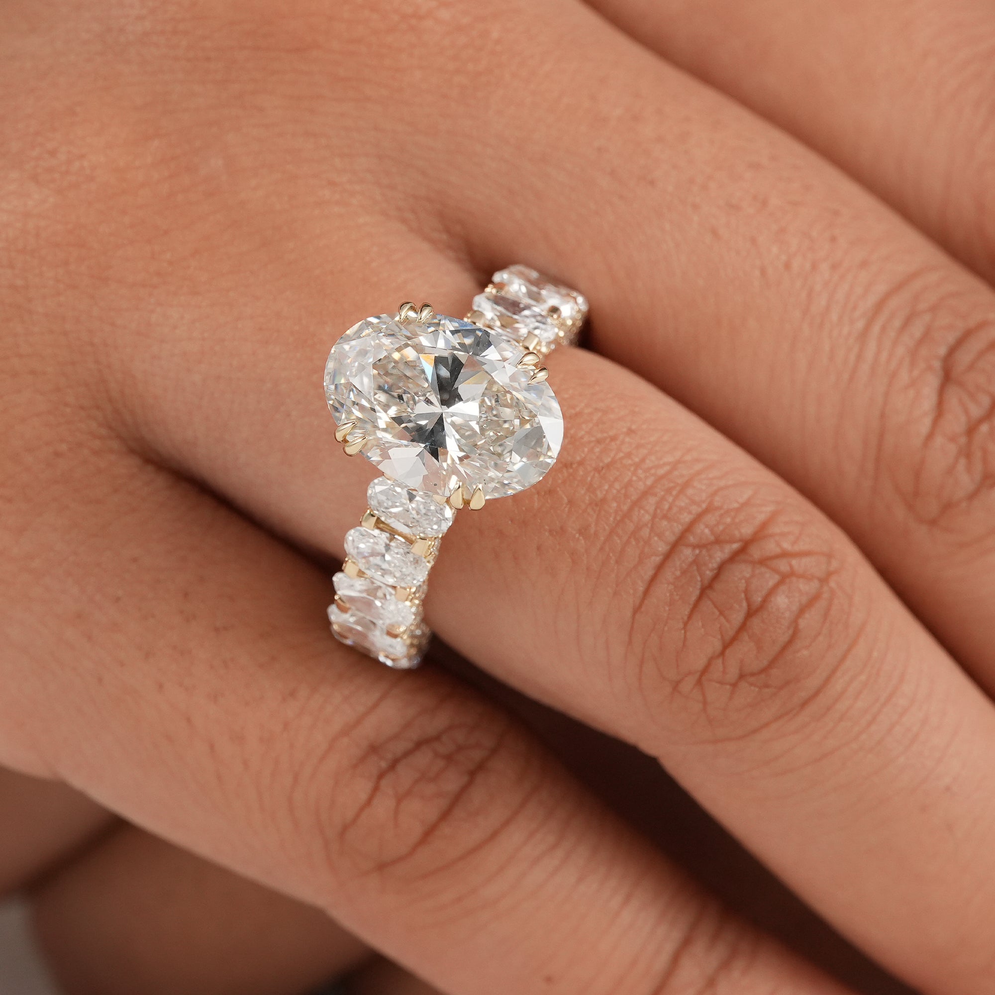 Fine jewelry oval engagement ring featuring an IGI certified lab diamond and luxury band.