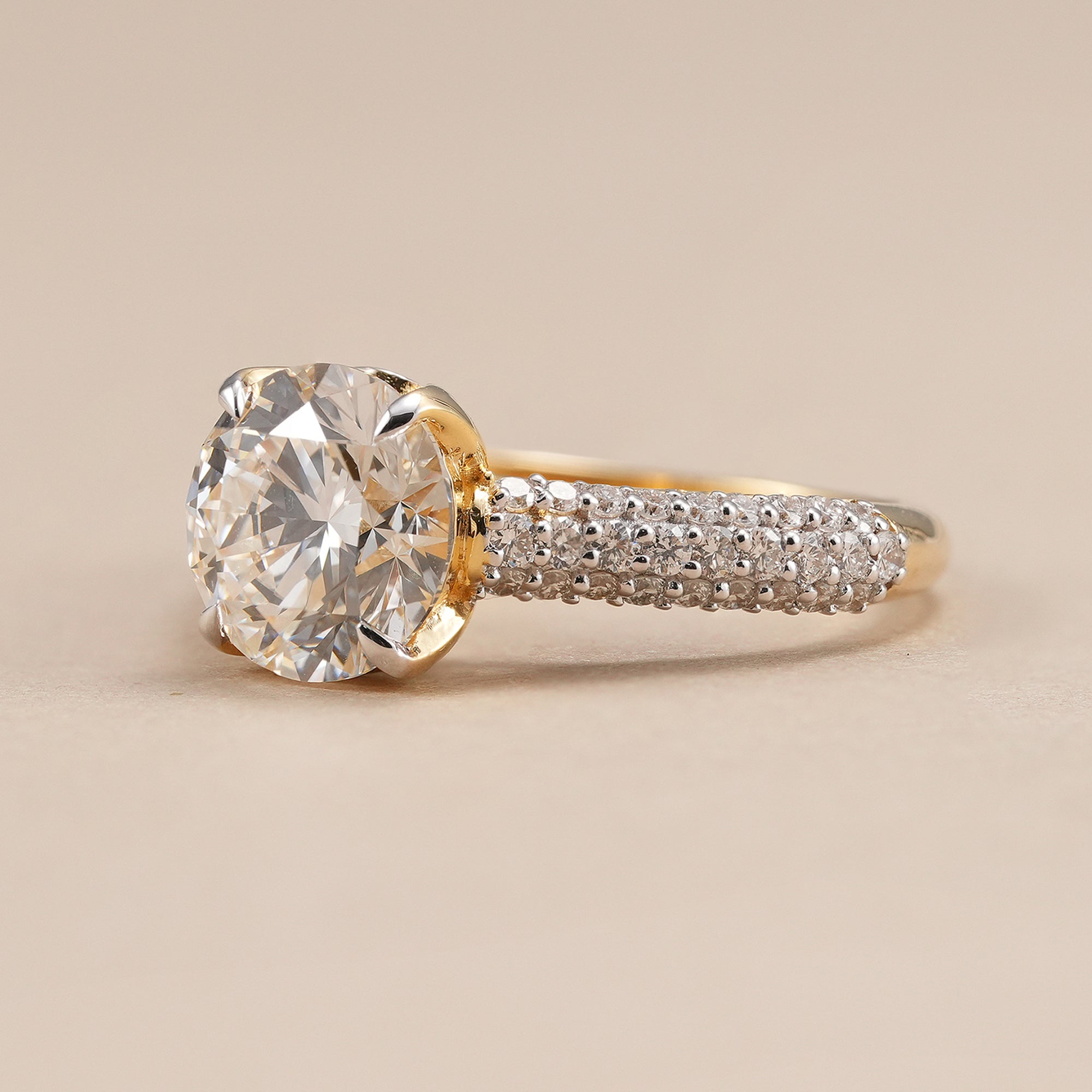 Round diamond engagement ring with cathedral inspired pavé band