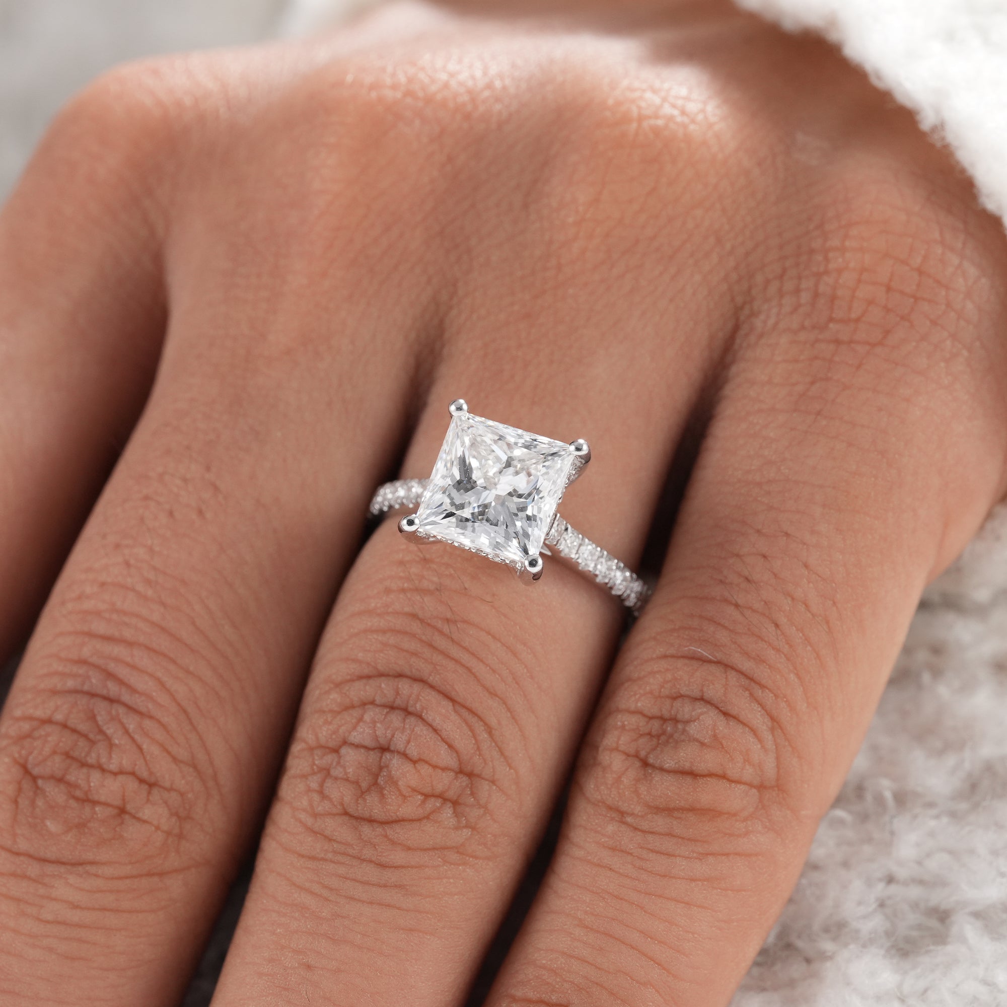 Modern princess diamond ring handcrafted in white gold.