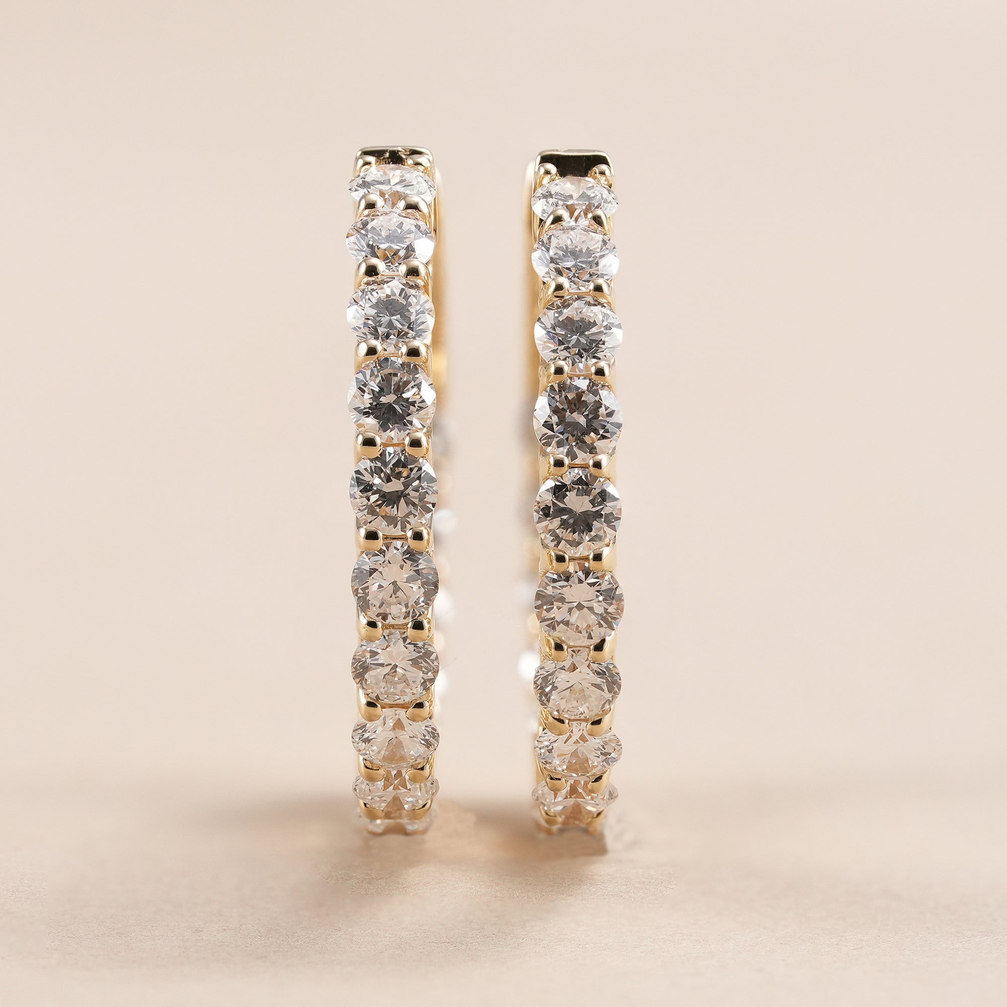 Classic diamond hoop earrings featuring round brilliant lab grown diamonds