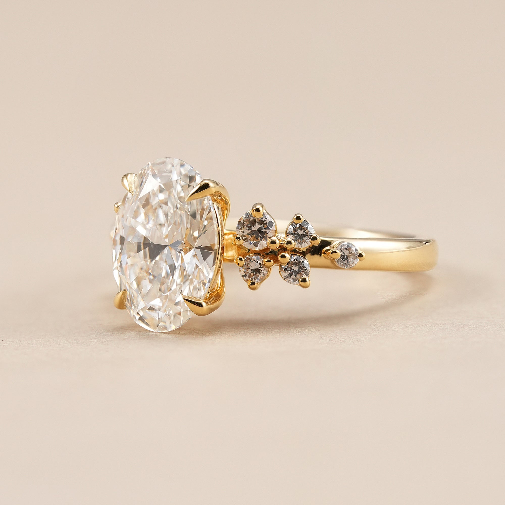 Oval engagement ring with sparkling floral accent diamonds