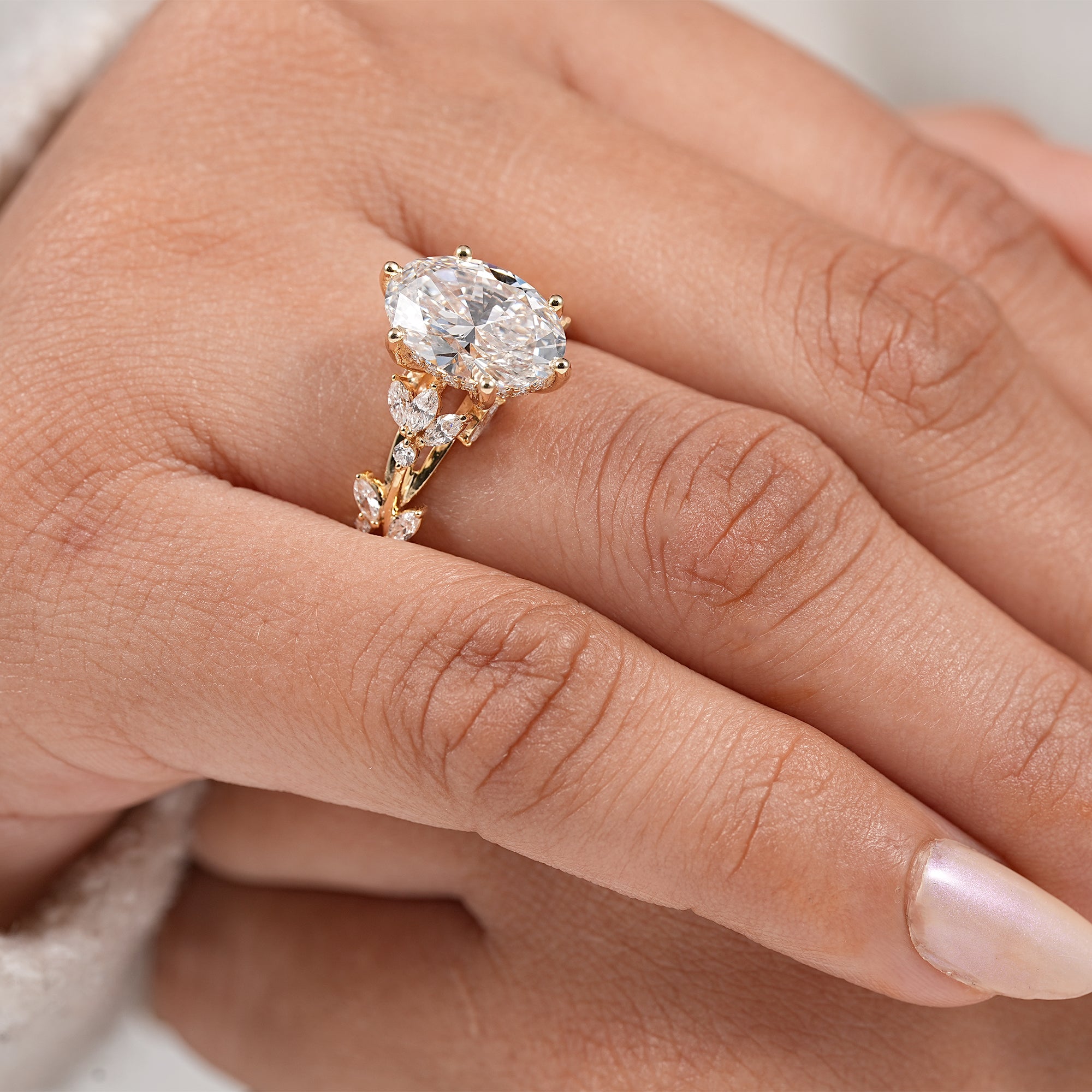 Nature inspired bridal ring with oval lab created diamond and botanical gold setting
