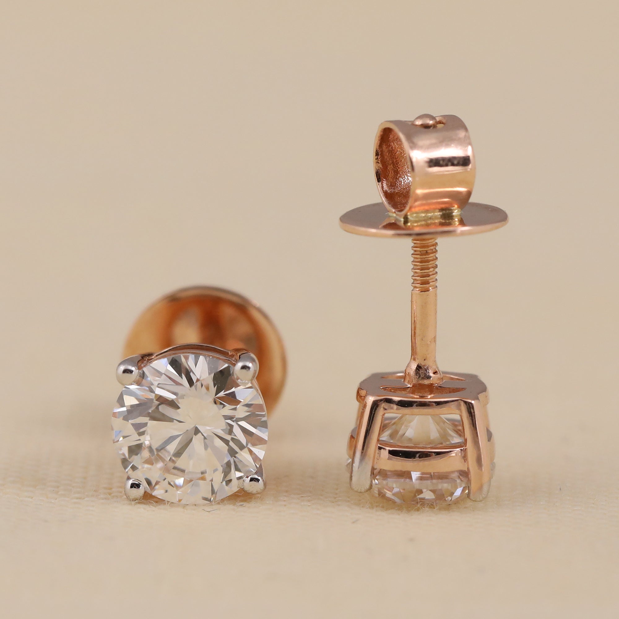 Elegant round solitaire diamond studs designed for wedding events or anniversary moments.