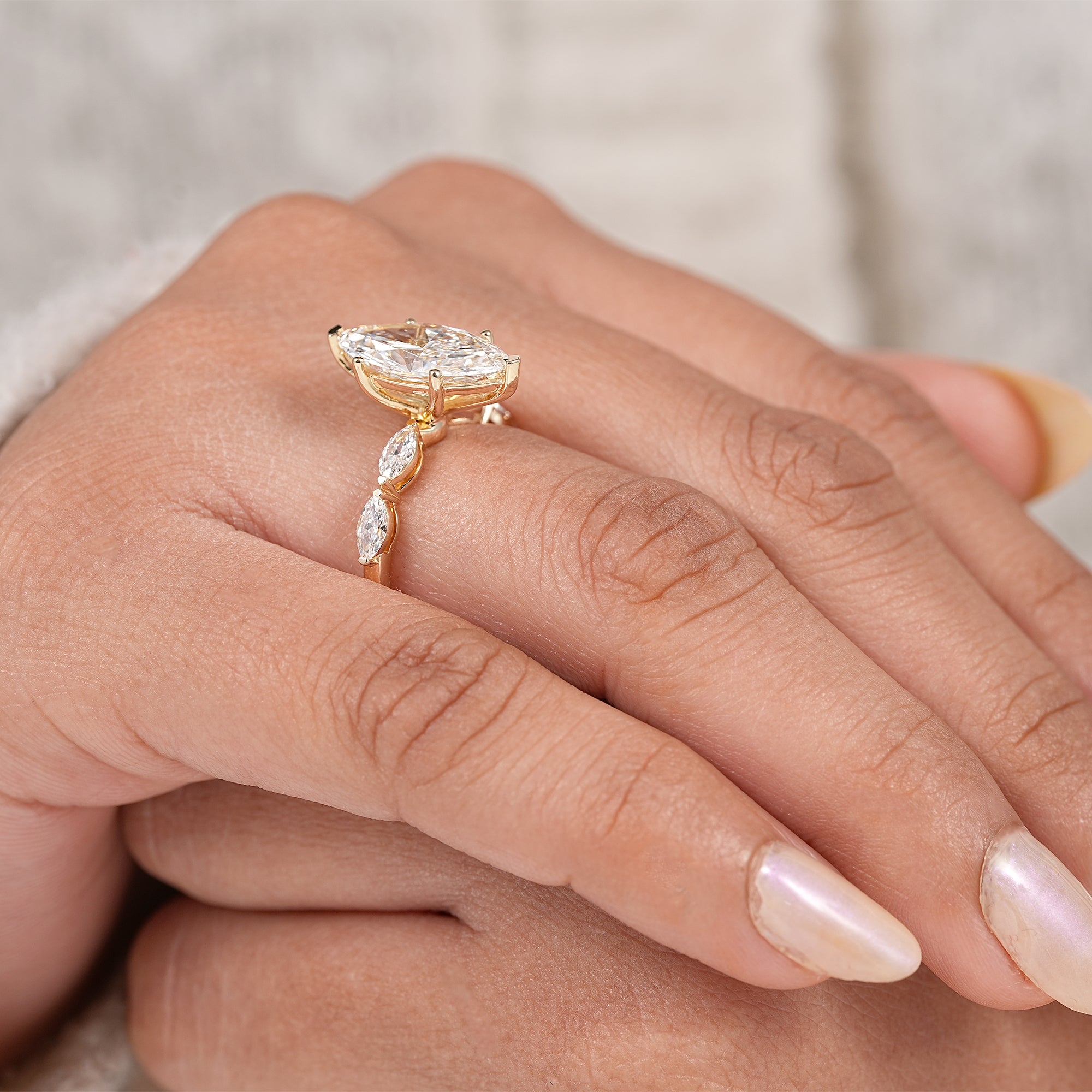 Timeless marquise cut engagement ring with elegant marquise accent band
