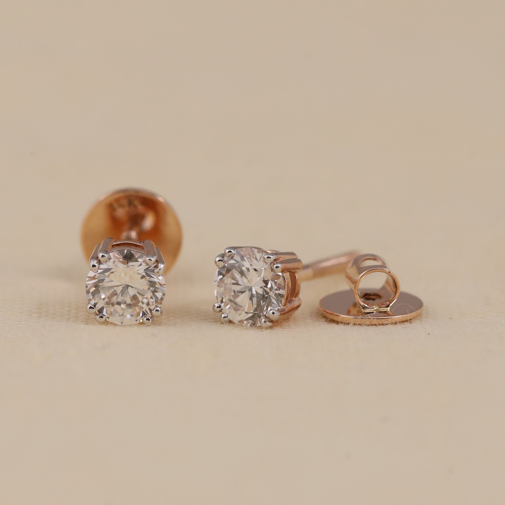 Sparkling round diamond stud earrings suited for parties or festive events