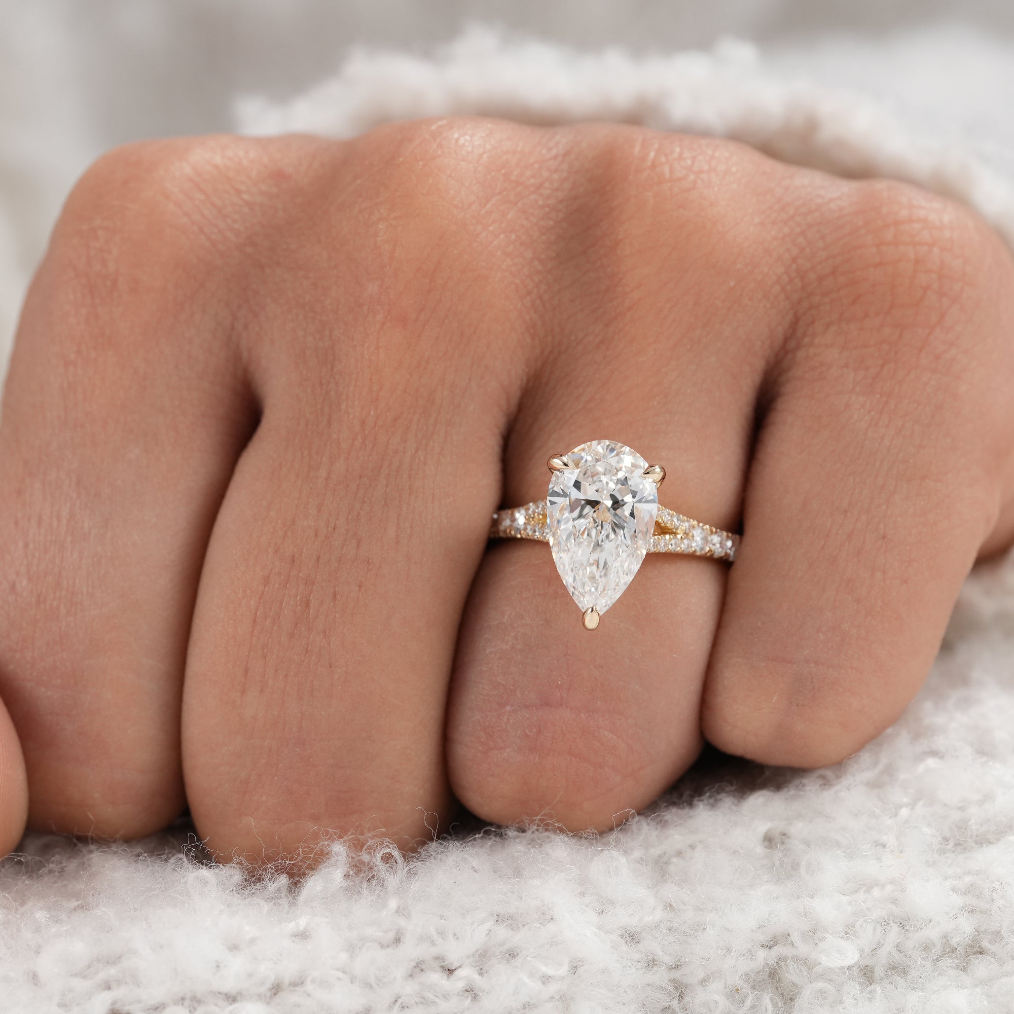 Pear diamond split shank ring with pavé diamond detailing