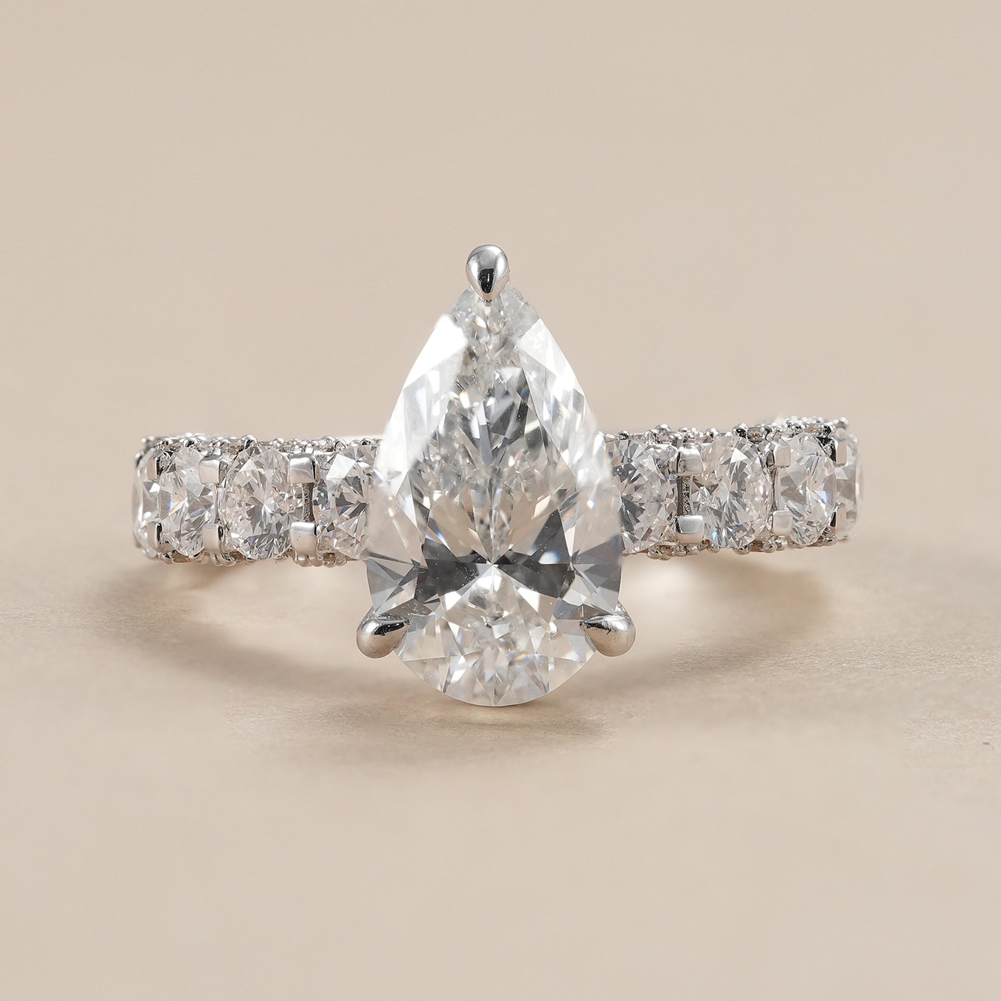 3 CT pear lab grown diamond engagement ring with hidden halo.
