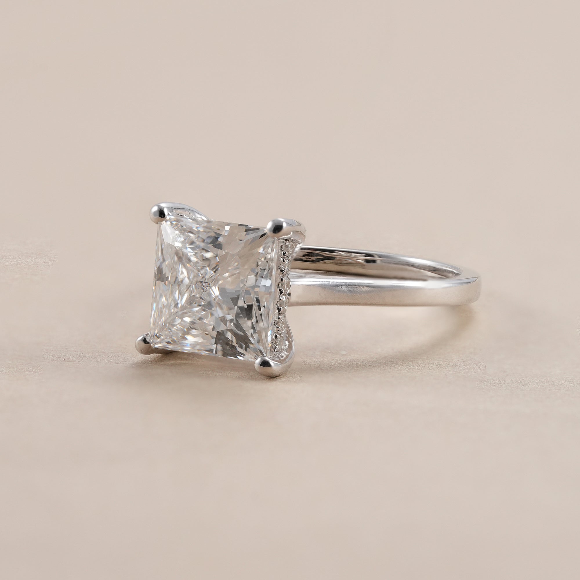 IGI certified princess cut solitaire diamond engagement ring in white gold.
