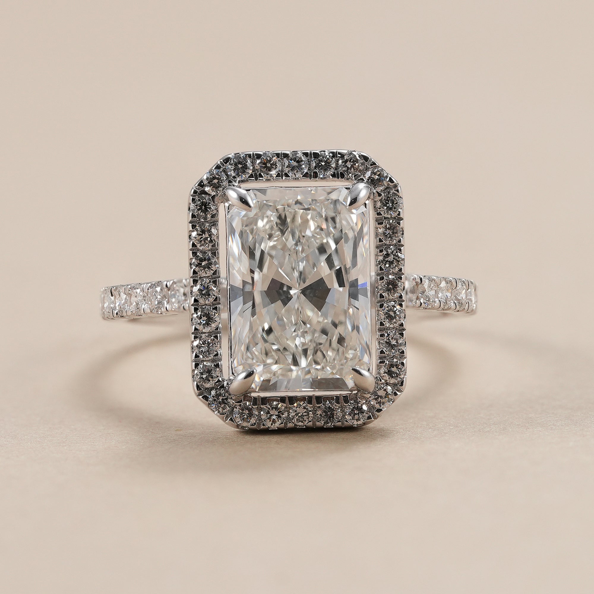 3 CT radiant lab grown diamond halo engagement ring with pavé band.