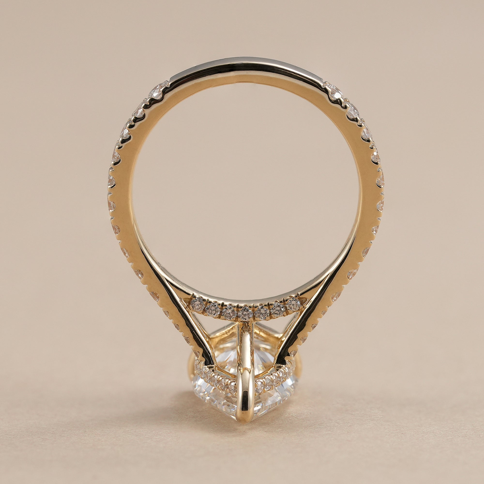 Pear lab diamond engagement ring with round diamond accents