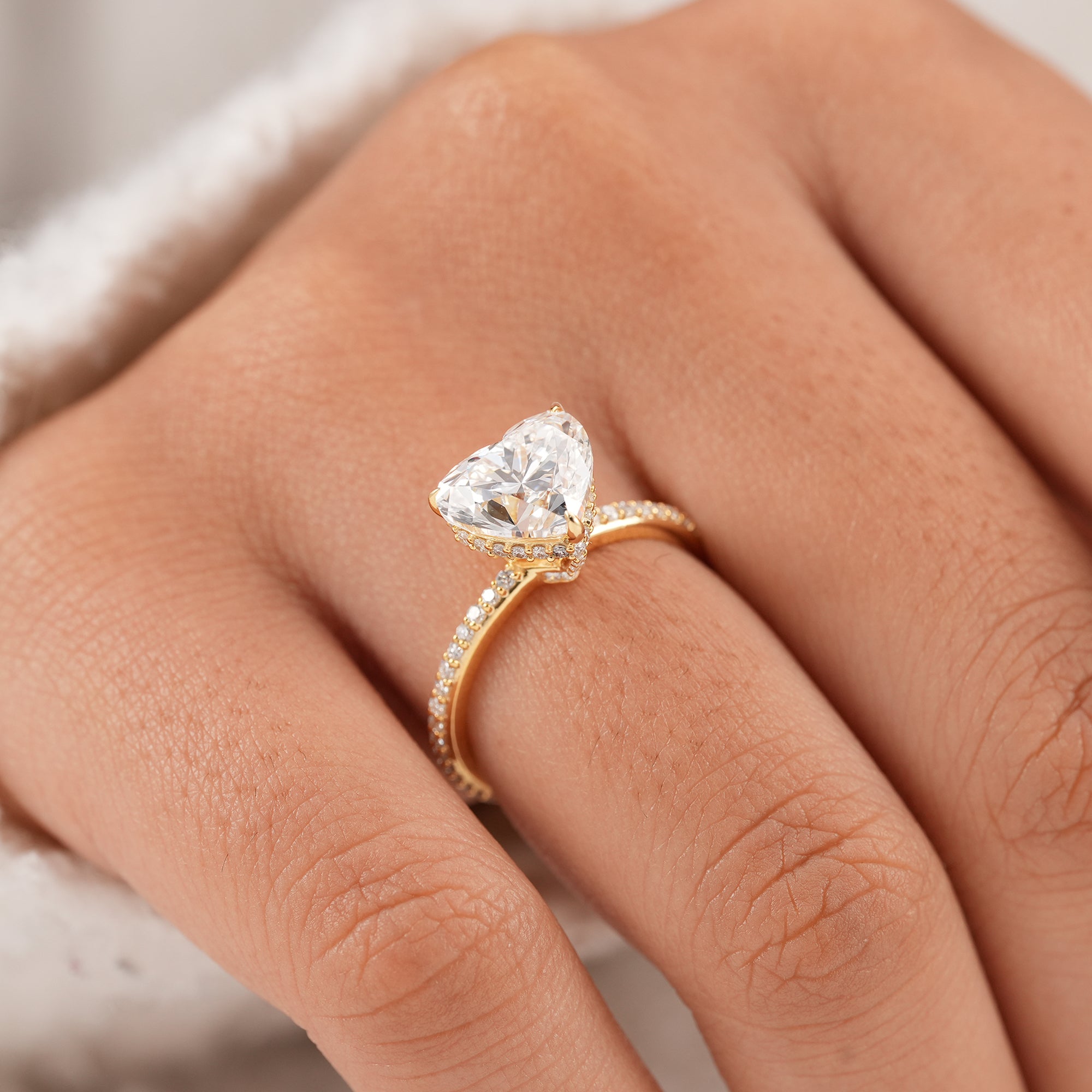 Heart shape lab grown diamond ring featuring a classic solitaire design