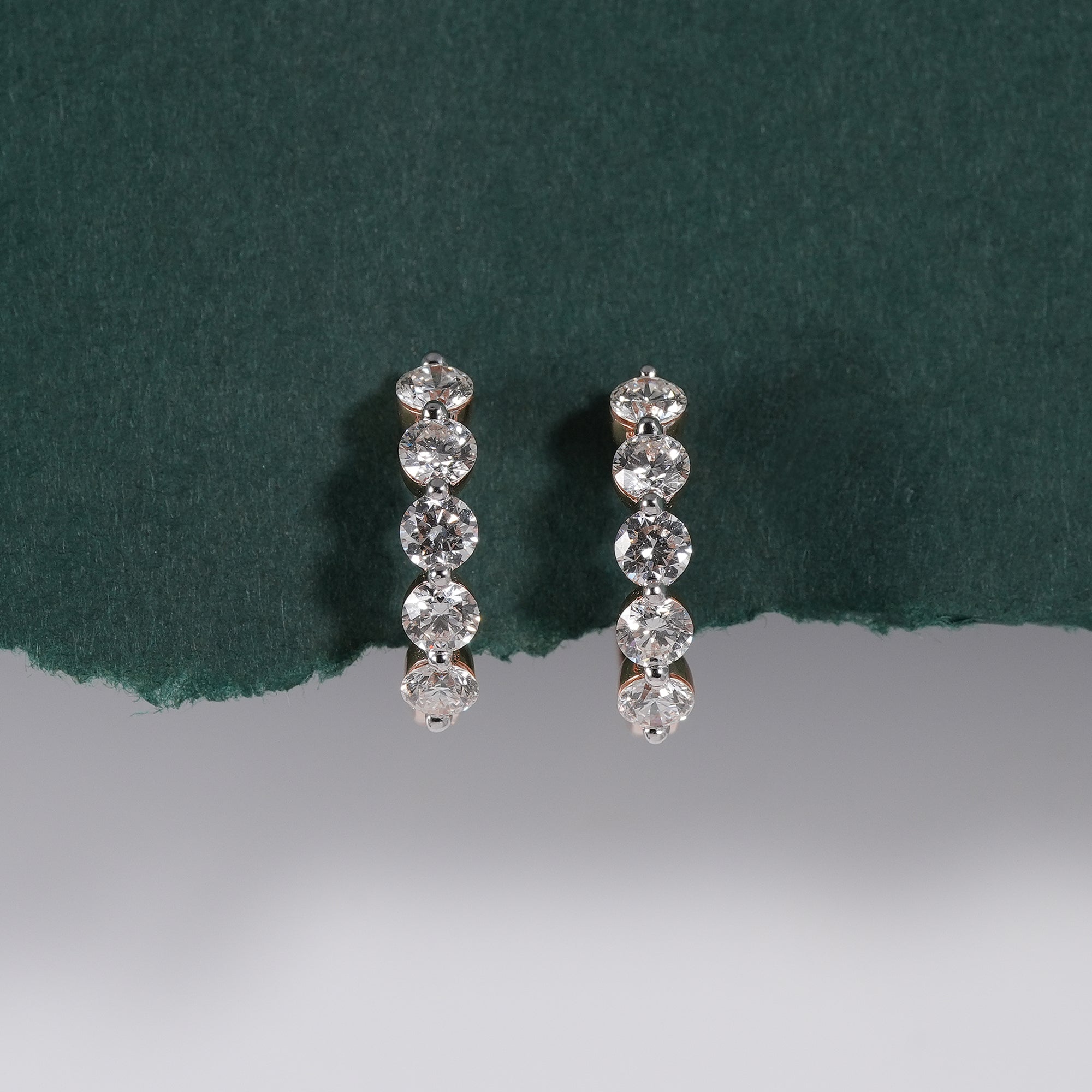 Round brilliant diamond huggie earrings handcrafted in fine gold