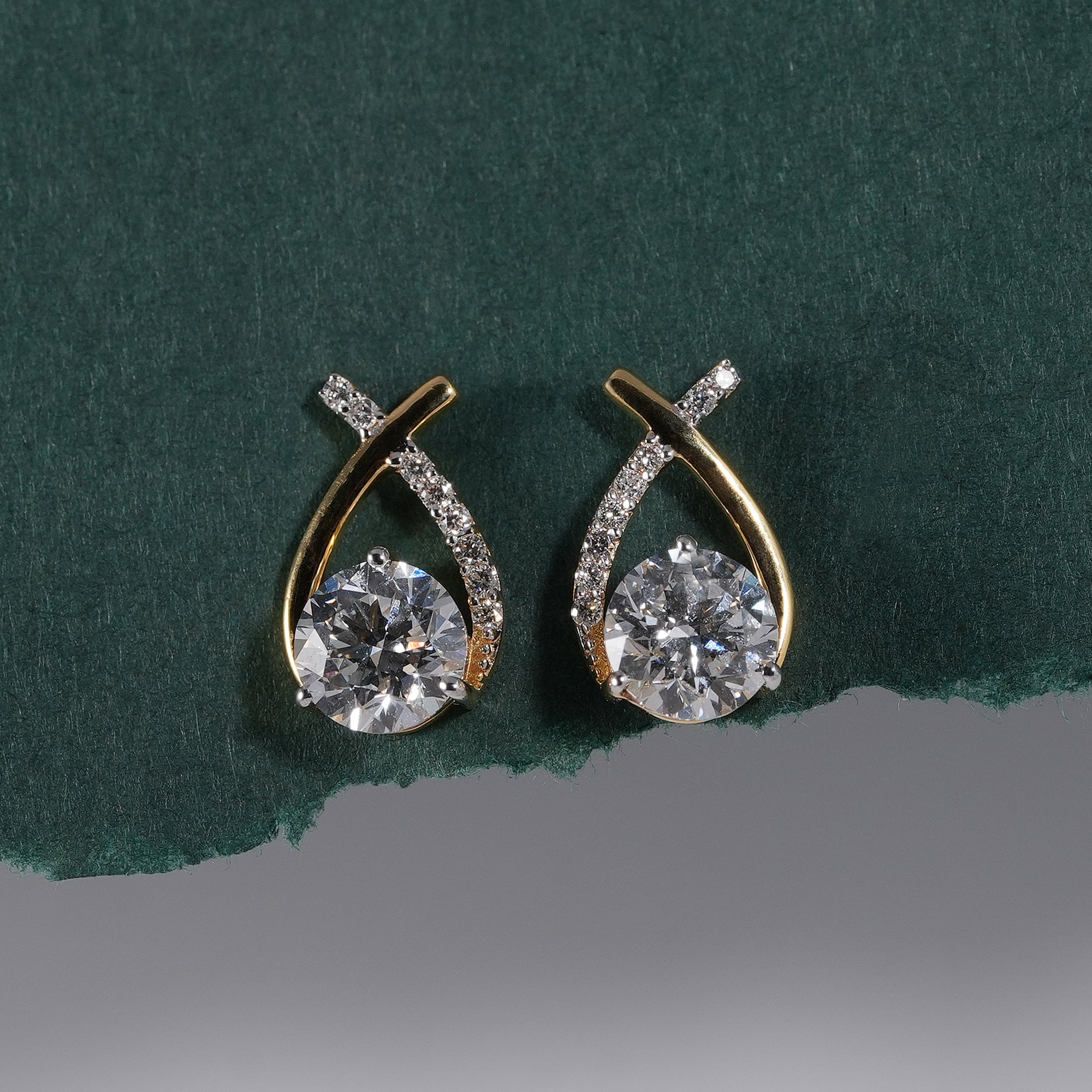 Infinity inspired diamond stud earrings featuring round brilliant diamonds
