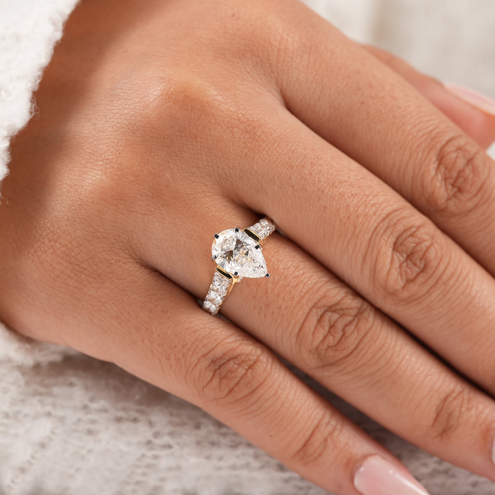 IGI certified pear diamond bridal ring with pavé band