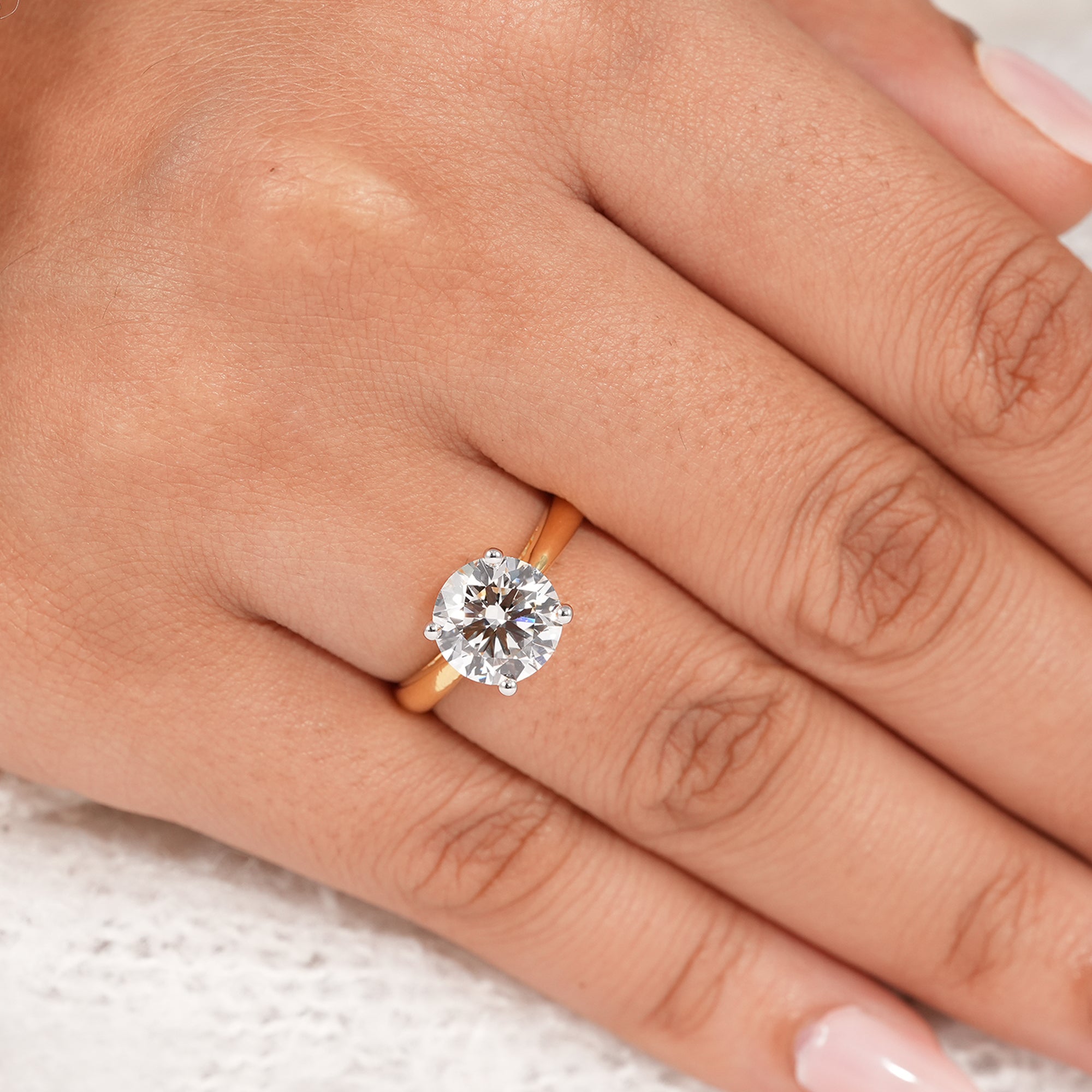 Elegant round solitaire engagement ring handcrafted in yellow gold