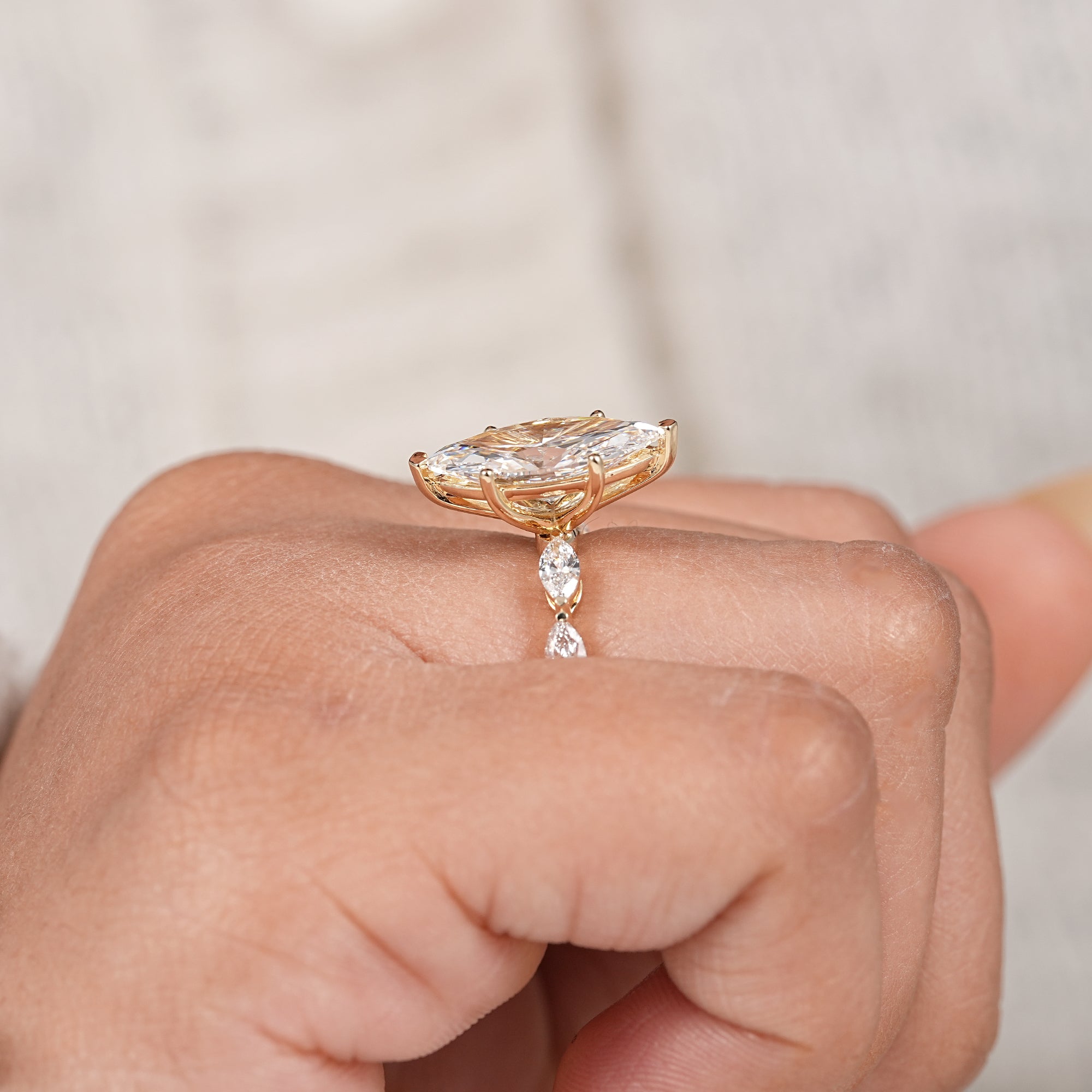 Marquise shaped lab created diamond engagement ring with floral inspired accents