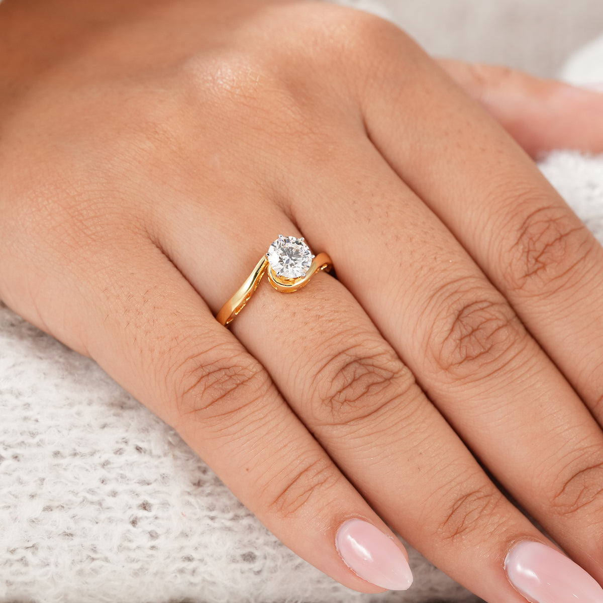 Round brilliant solitaire ring designed as a meaningful anniversary or birthday gift for her.