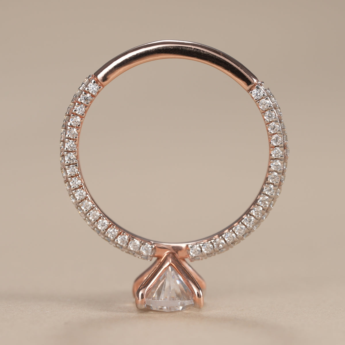 Pear cut solitaire ring featuring an ethically sourced lab grown diamond in solid gold.