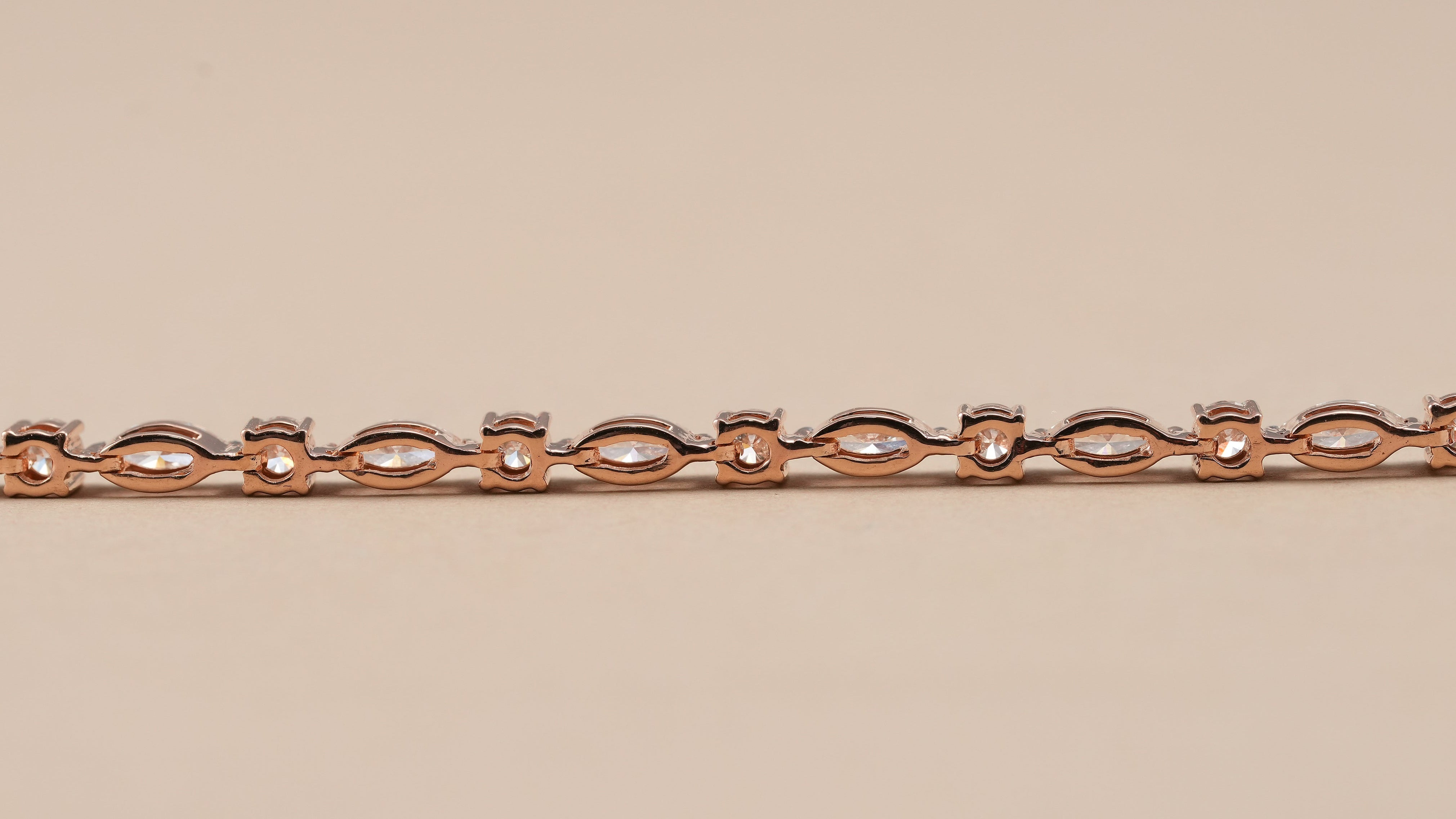 Fine jewelry alternating diamond tennis bracelet in polished rose gold
