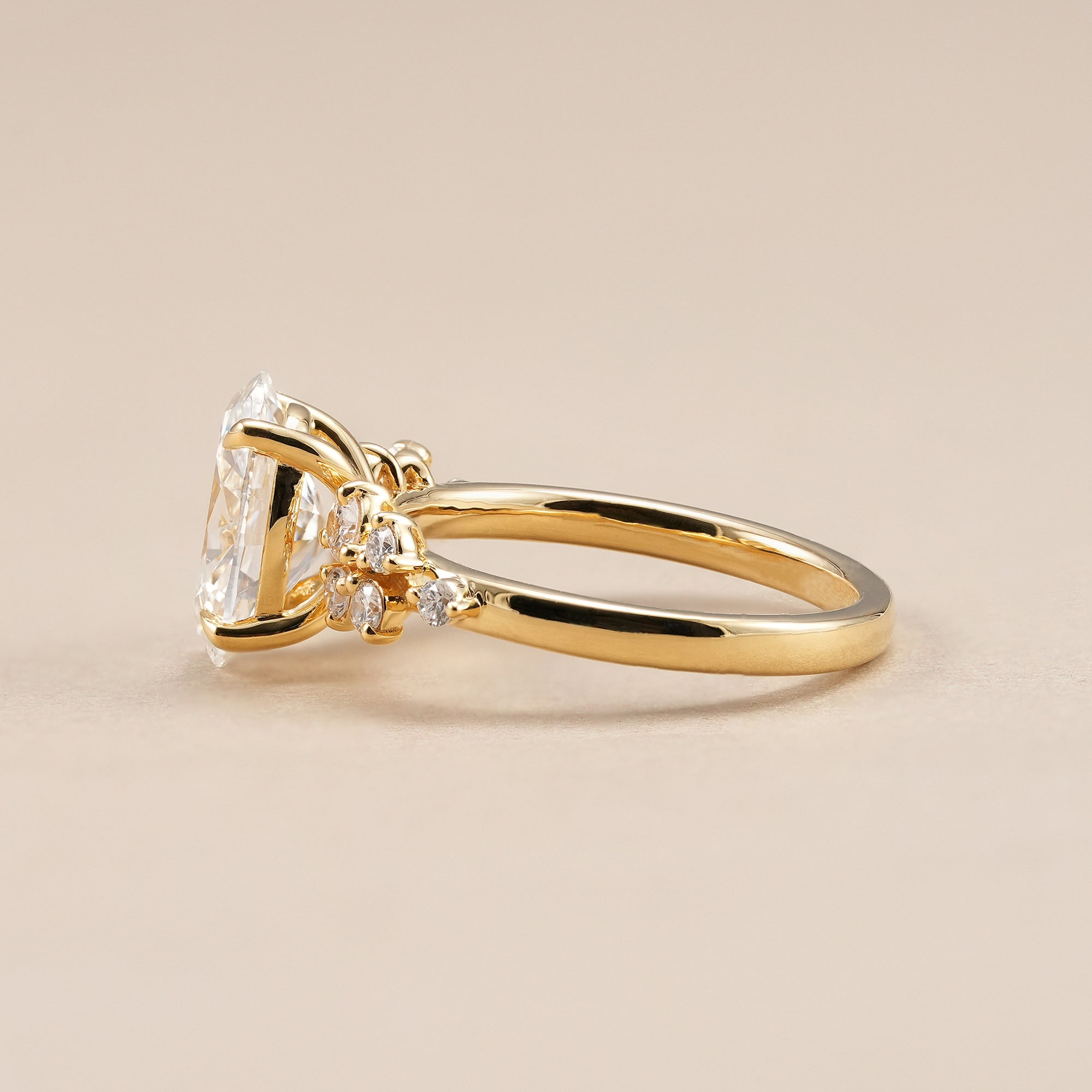 Elegant oval cluster engagement ring with brilliant lab diamond