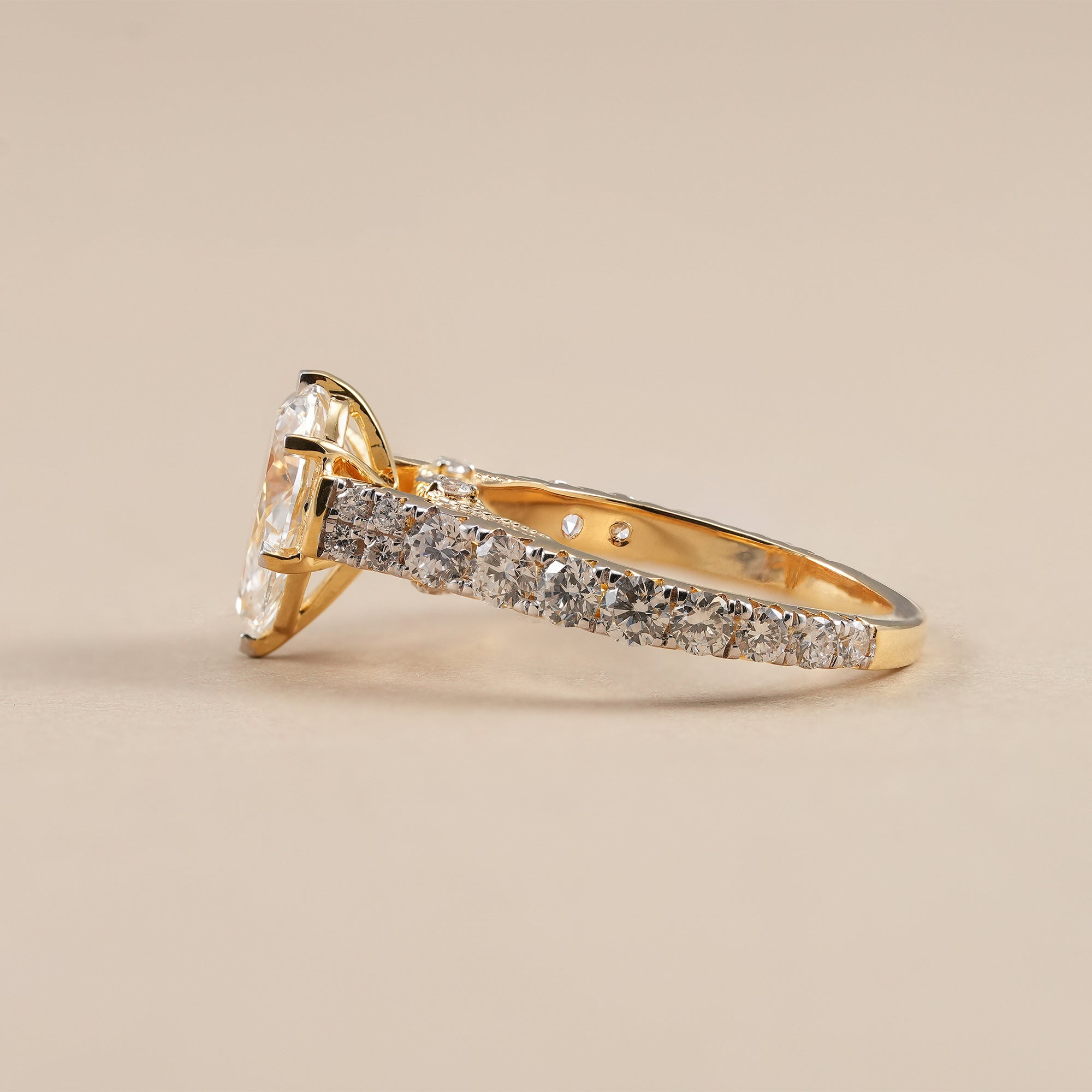 Elegant pear cut lab diamond ring with vintage inspired engraving