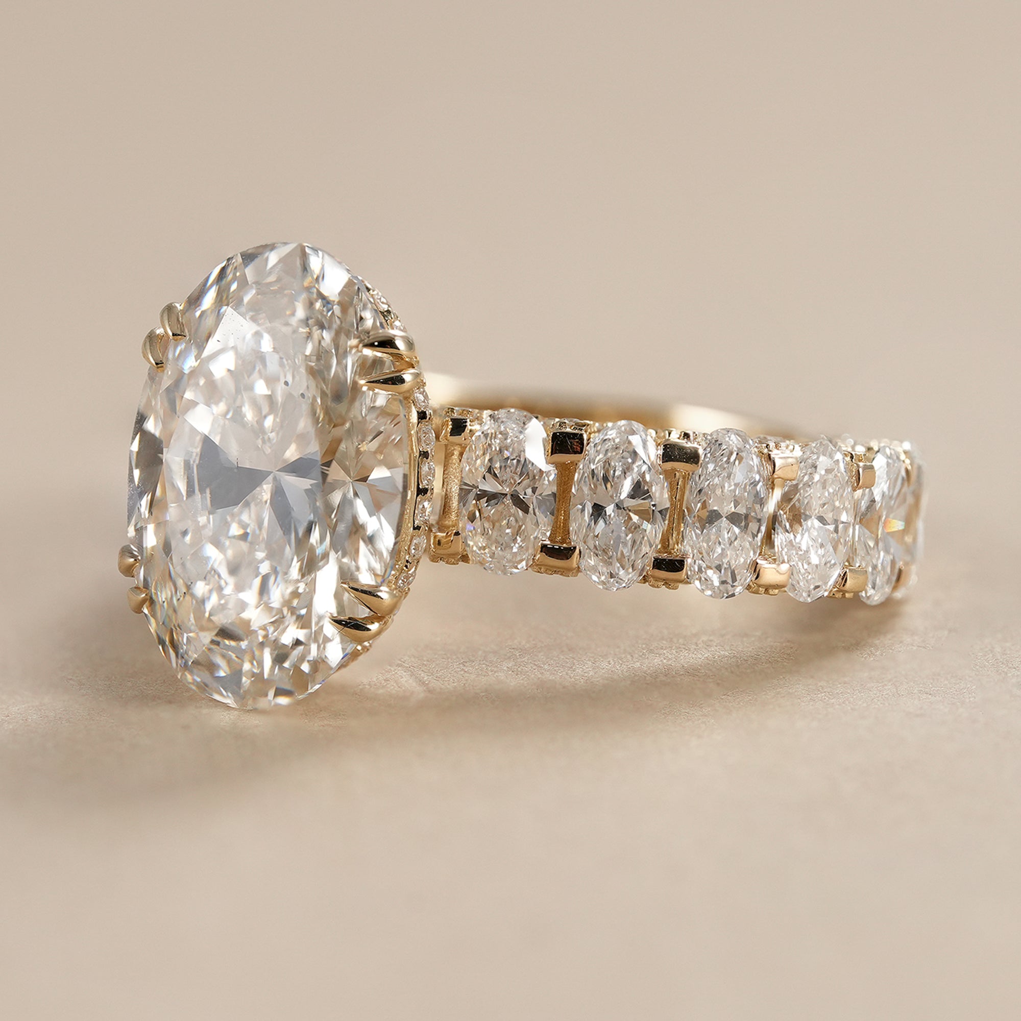 IGI certified oval lab diamond ring featuring a full diamond band crafted in polished yellow gold.