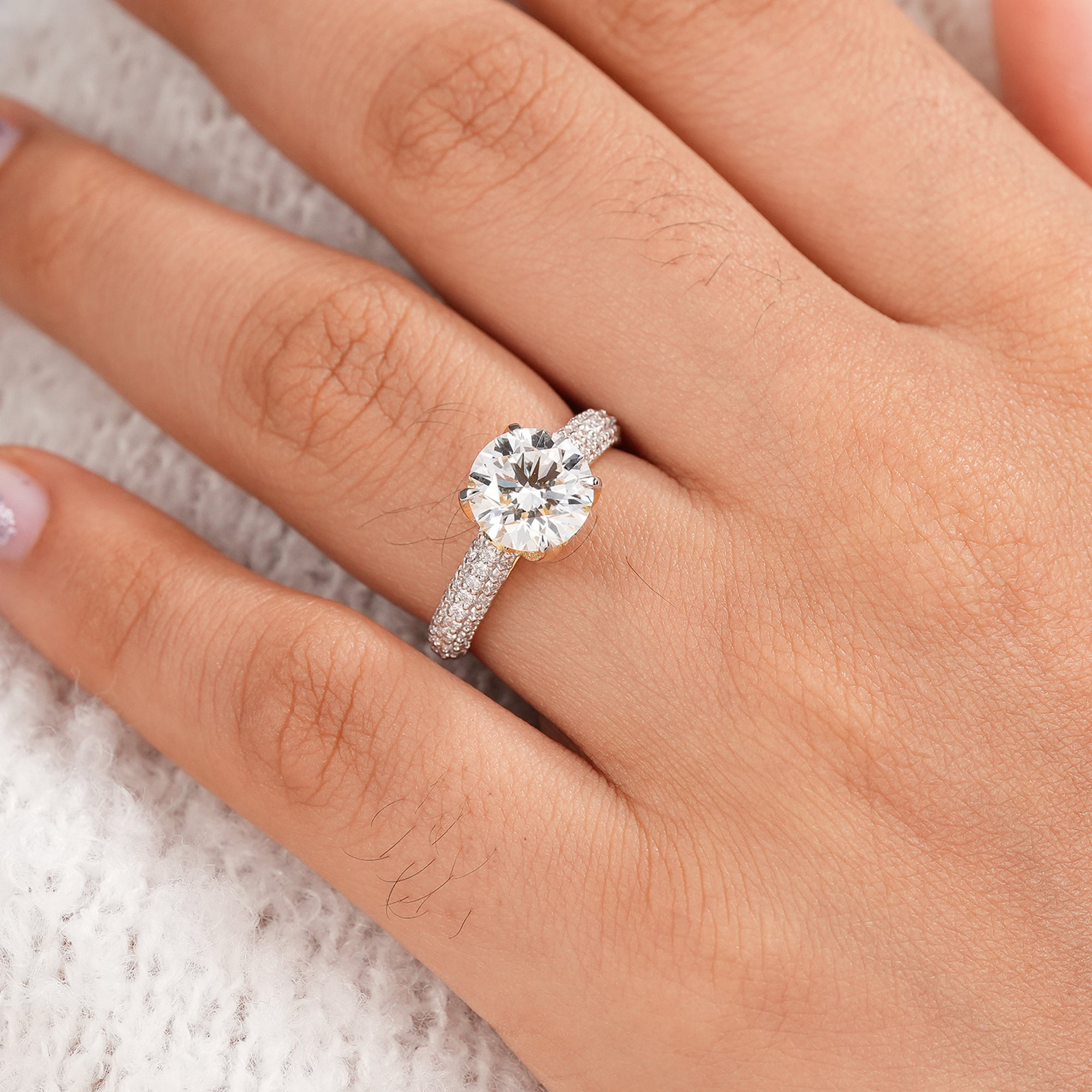 Luxury round engagement ring with triple pavé diamond shank