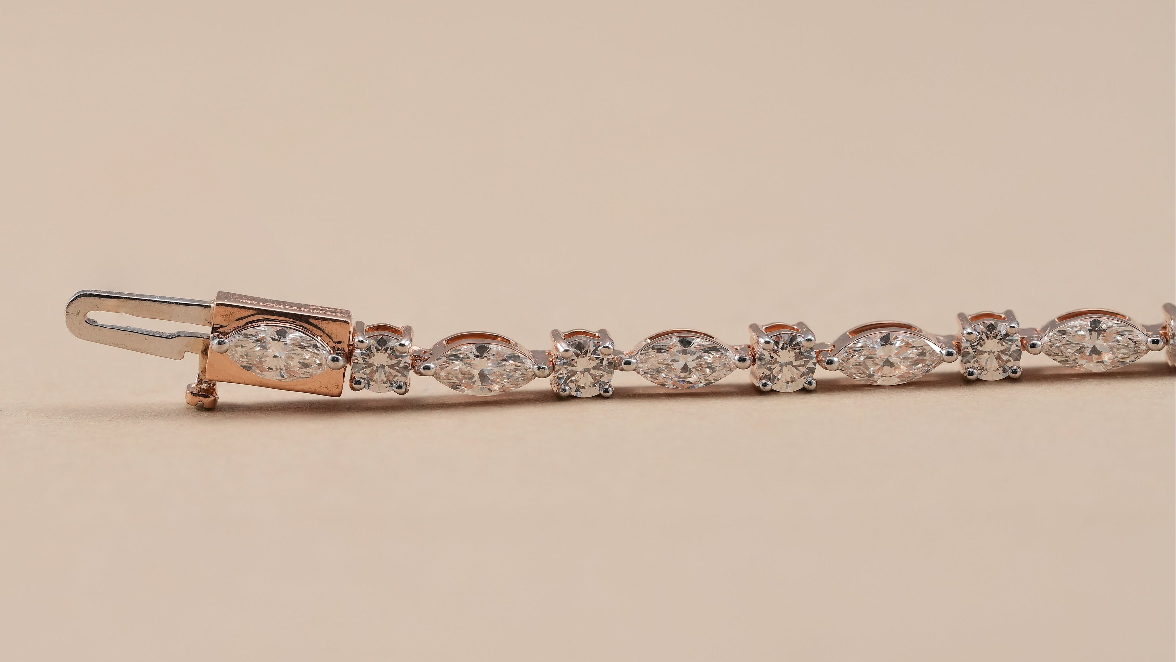 Classic diamond tennis bracelet featuring round and marquise diamonds